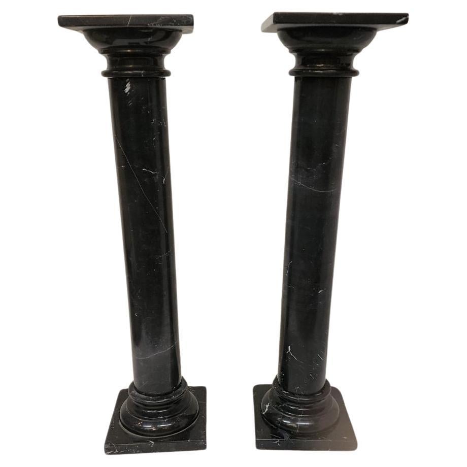 Black marble pedestals