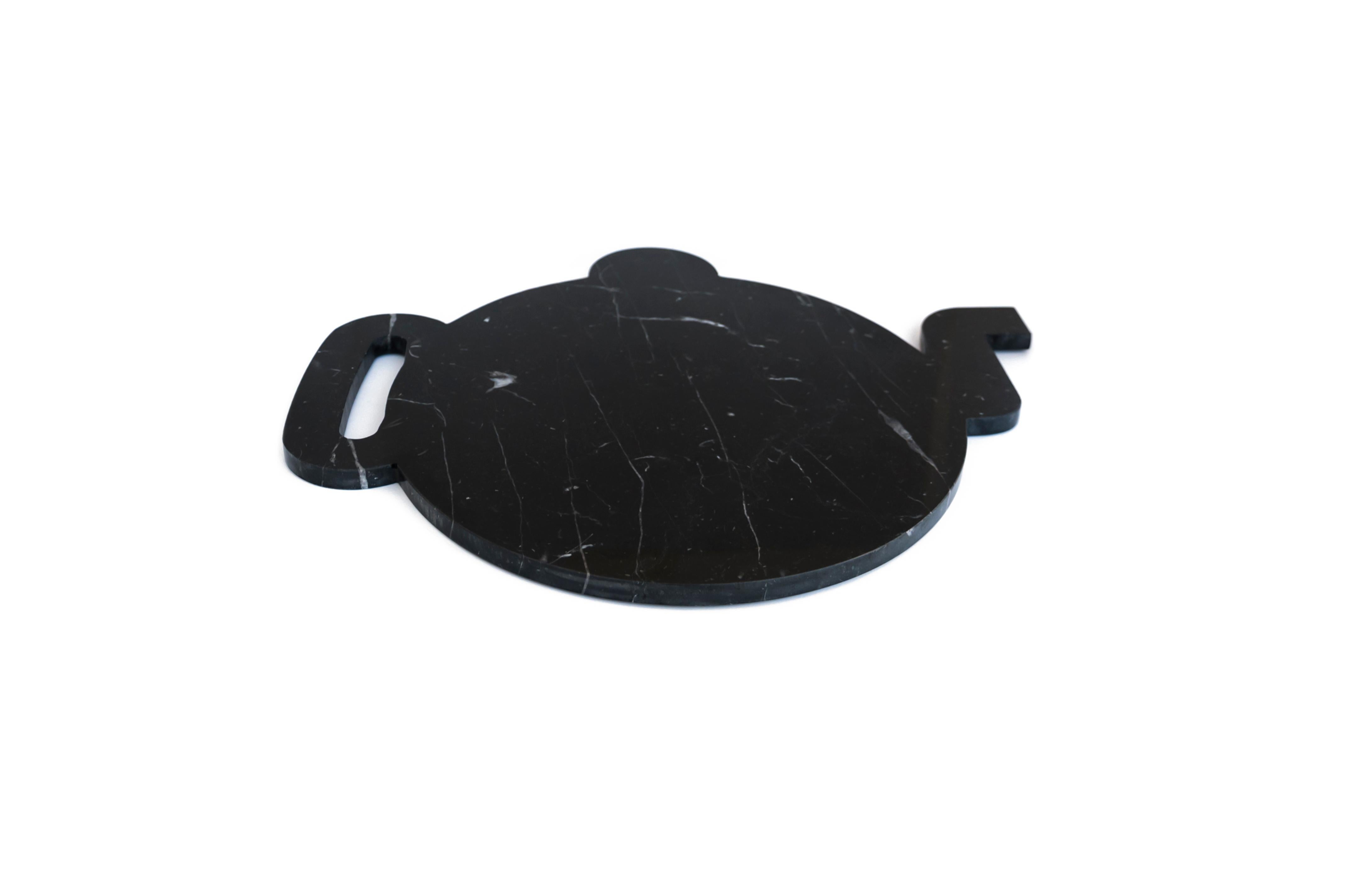 Black Marquina marble plate, tray and chopping board with the shape of a teapot. Each piece is in a way unique (every marble block is different in veins and shades) and handmade by Italian artisans specialized over generations in processing marble.