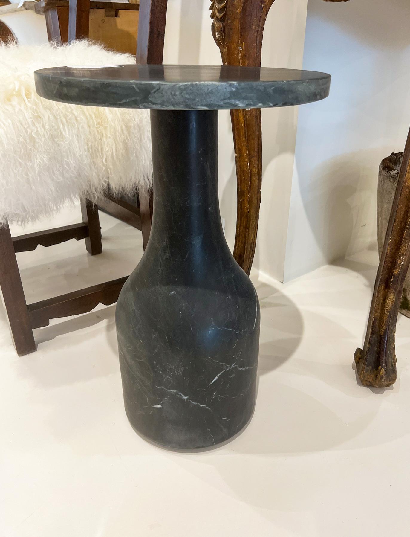 Solid marble side table with pleasing base shape and round top. It comes apart into two pieces. The perfect size that will fit in anywhere. We also have a similar product in white marble. 