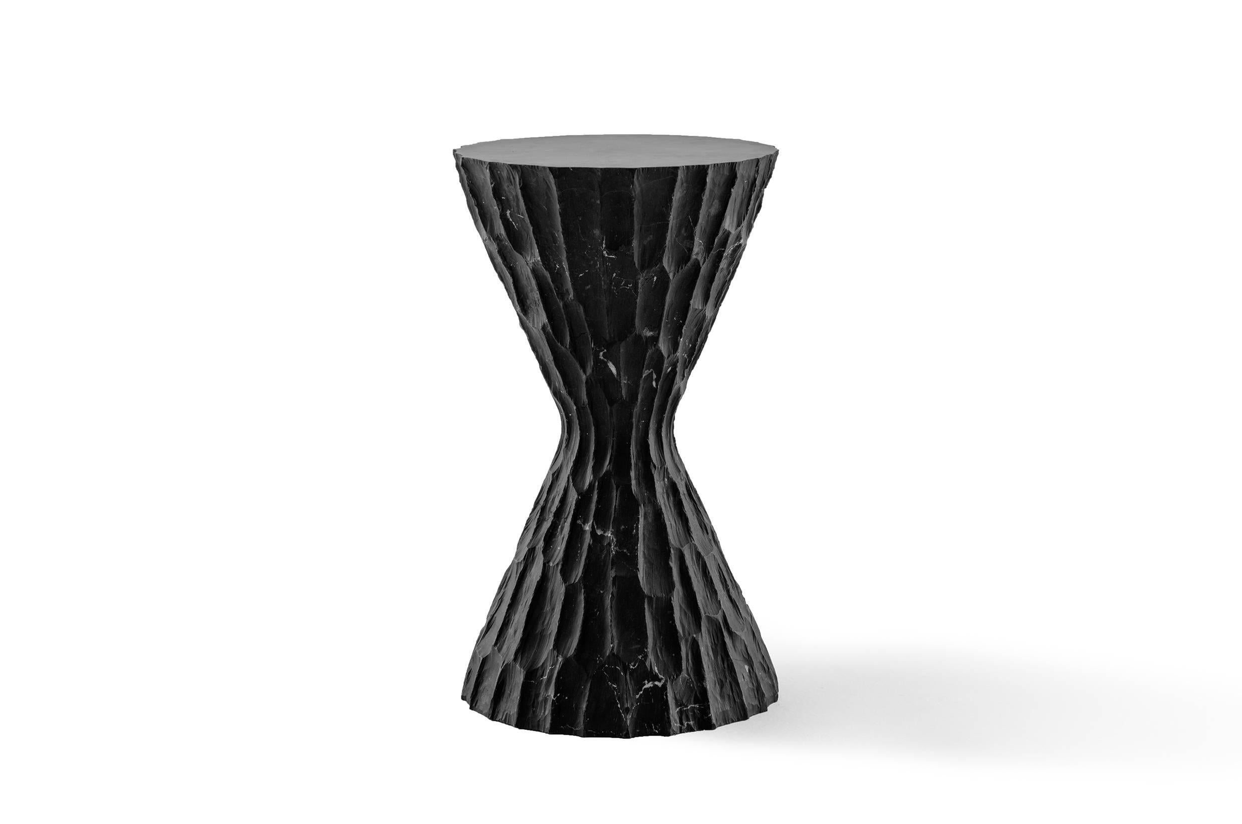 This side table in black marble is part of the Sacred Ritual Objects, collection by EWE Studio. Created out of fascination by the evolving skills of the artisans and their successful execution of exquisite objects, designed to ignite a connection