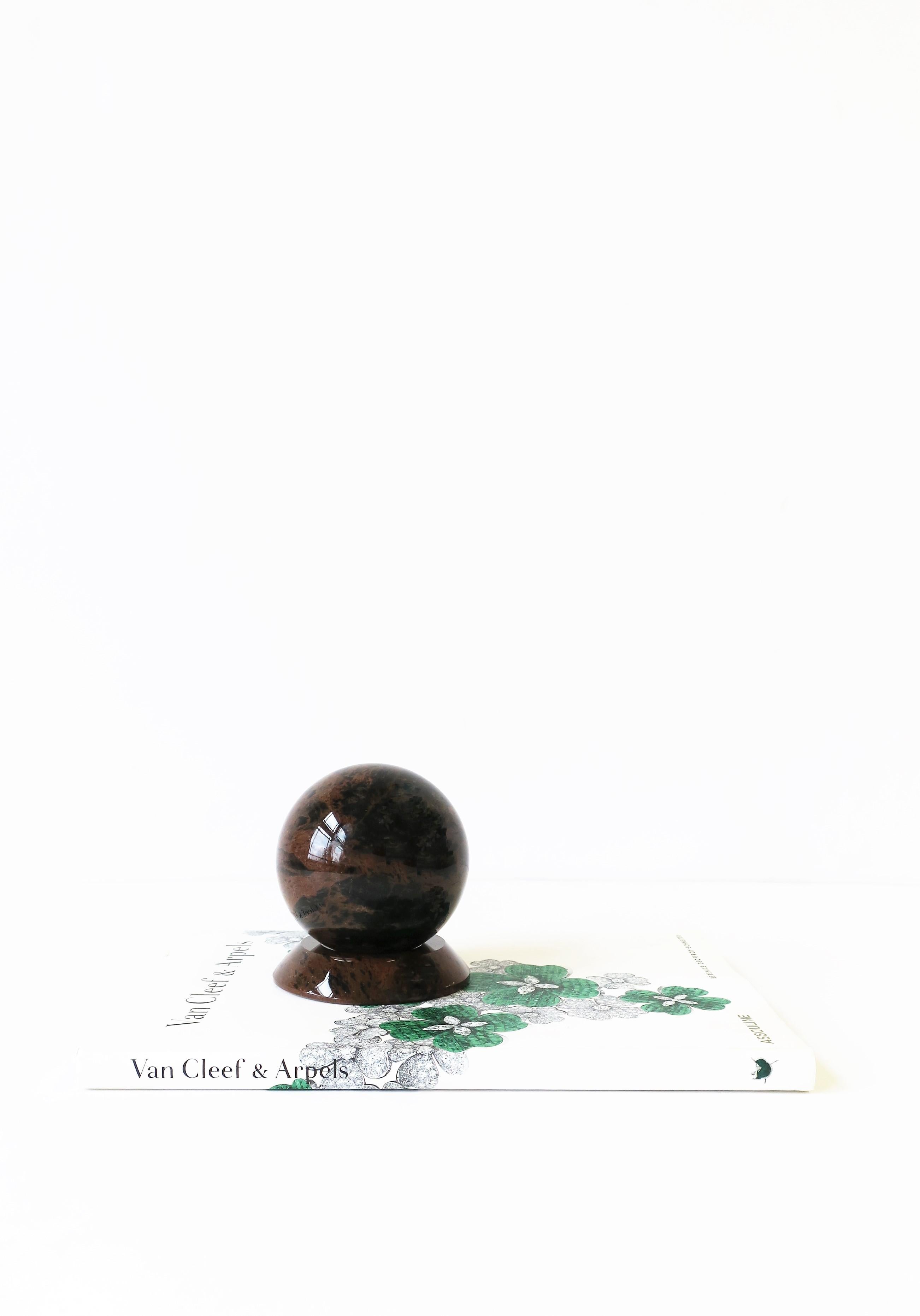A 1990s Postmodern black and brown polished marble sphere (with base) decorative object or desk accessory, circa 1990s. 

Dimensions: 2.88