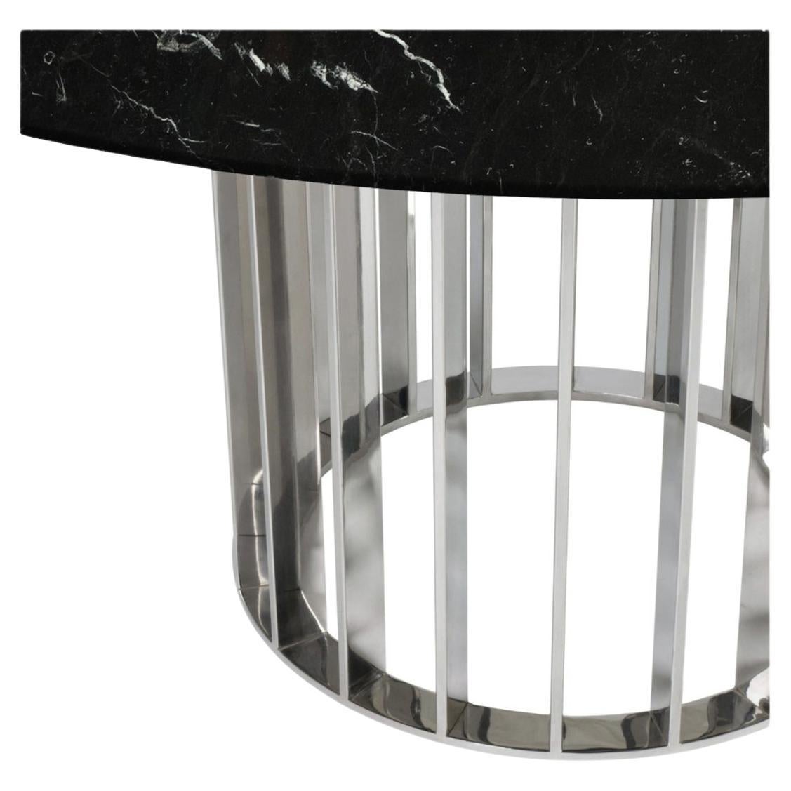 This unique dining table uses gorgeous Black marble top and elegant and modern stainless steel base uses the repetition of metal stripes to bring rhythm to the base. Its design is simple but full of grace and WOW factor. 
The best craftsmanship was