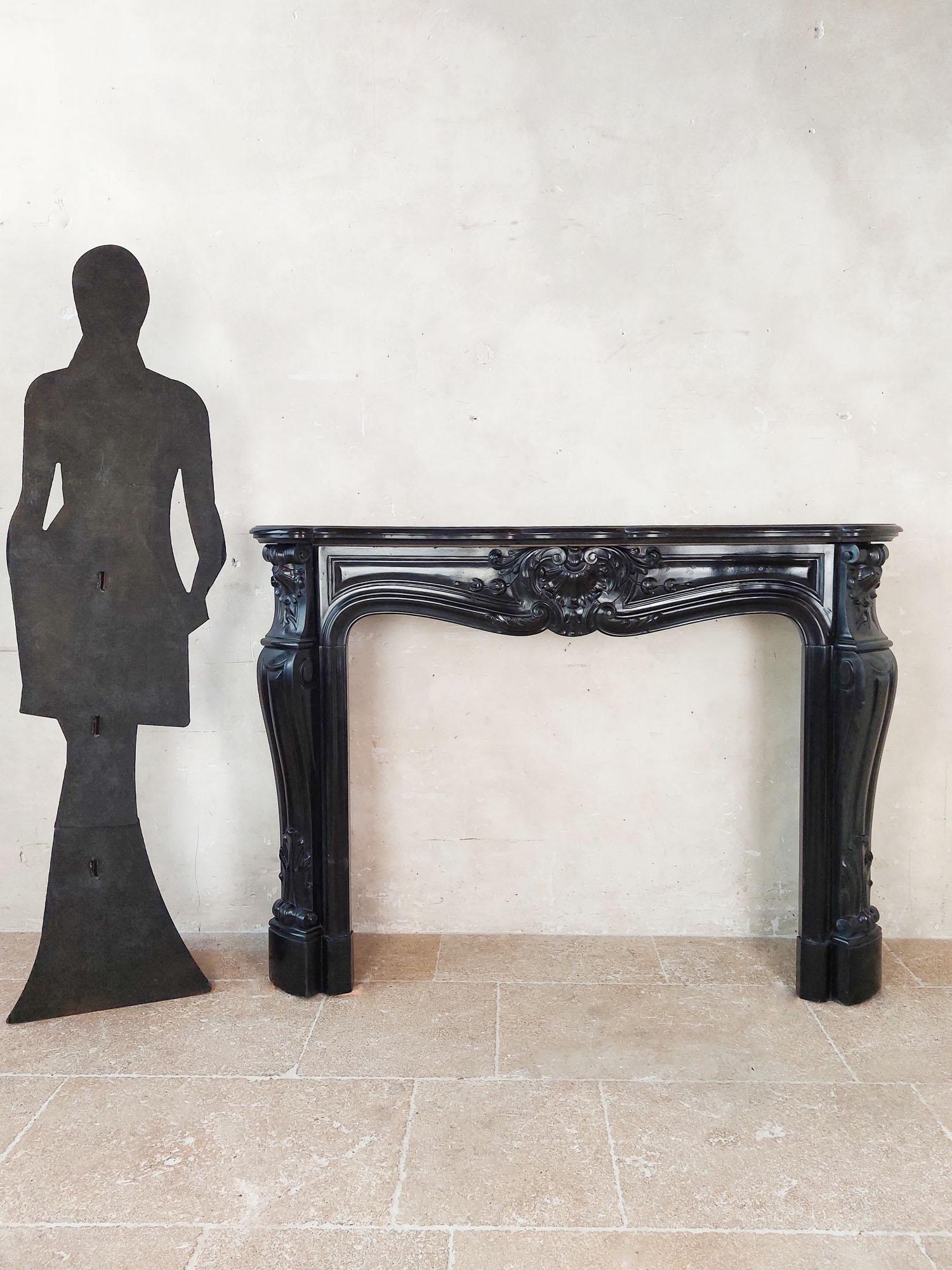 French Black marble trois coquilles mantelpiece For Sale