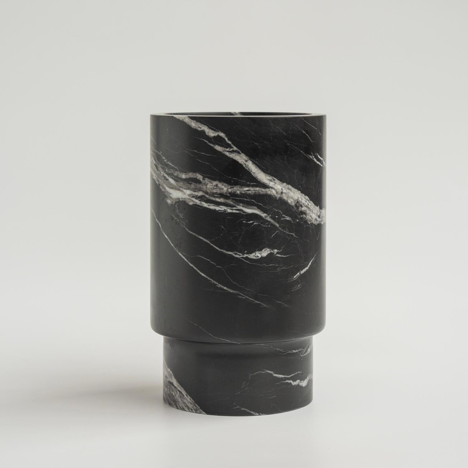 Crafted from a natural marble, this vase will be sure to win your heart. It can be used to hold your wine bottle, blooms, kitchen utensils and so much more. Place it in amongst your decor objects for a truly outstanding textural ornament. 

Overall