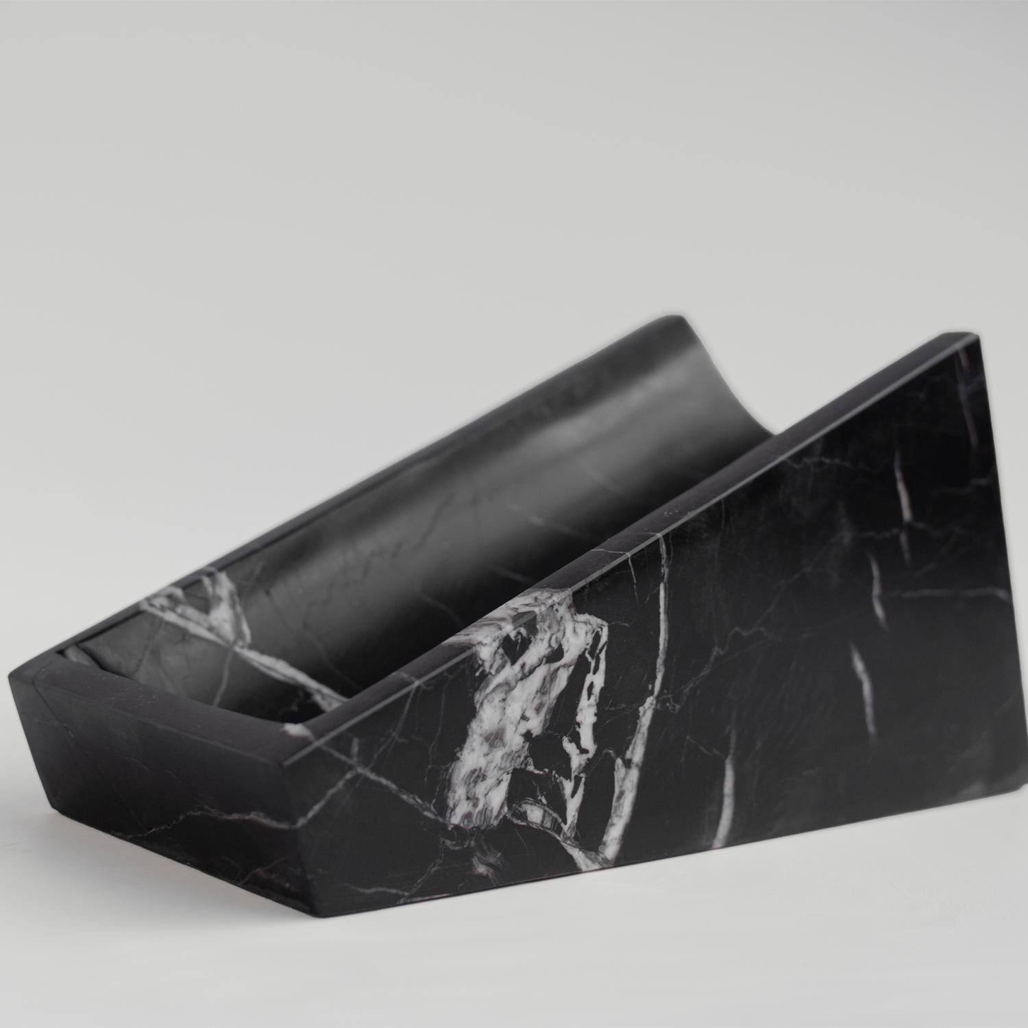 Put your wine on a style. Crafted entirely from marble, this wine holder is a beautiful way to put your favorite wine bottle on a kitchen counter or table, and is striking enough to work as a centerpiece for your tablescape. 

Overall dimensions: W:
