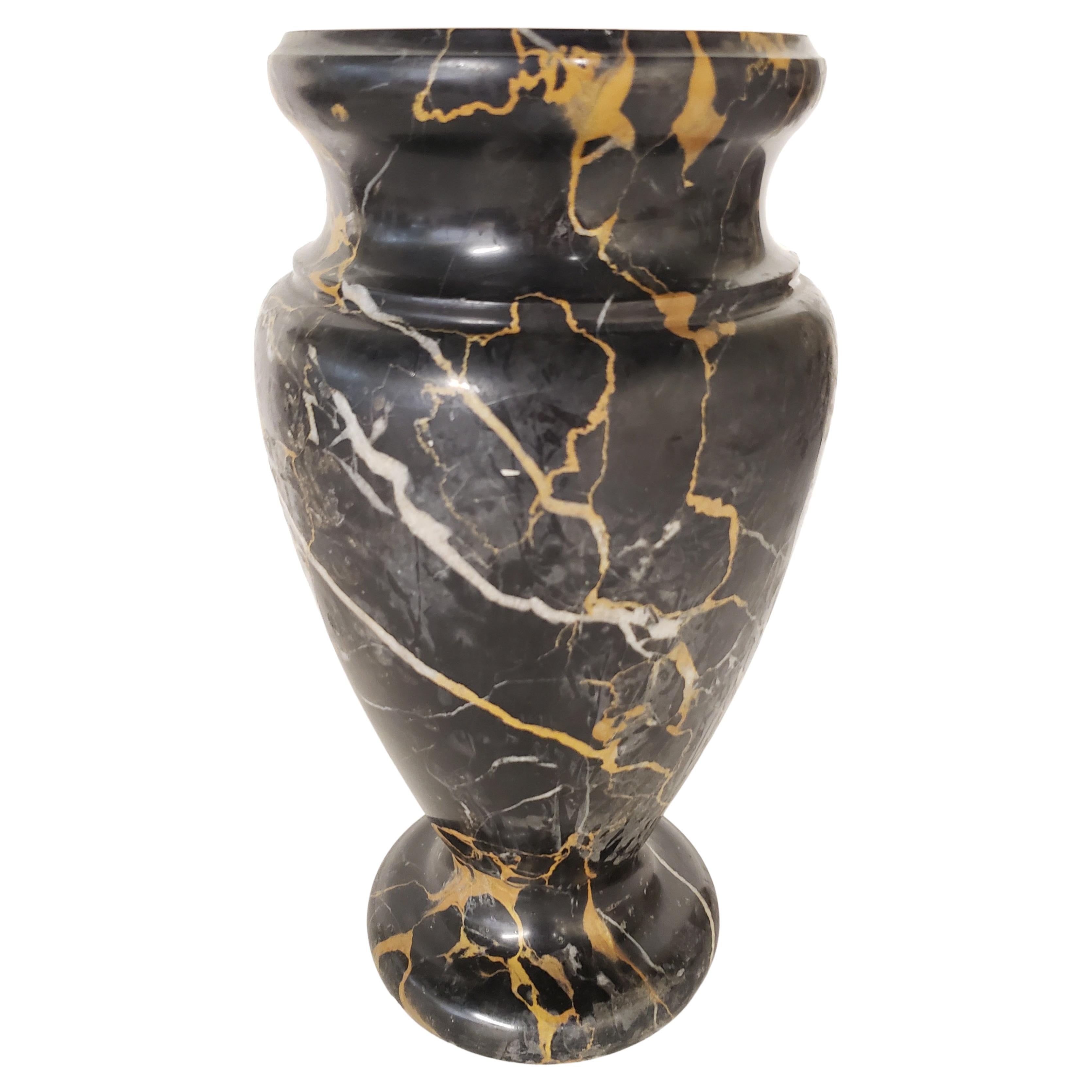 Italian black marble with gold and white veins vase from 1950s.
Good vintage condition
Measures 6 inches in diameter and stands 11 inches tall. Top opening is 3.15 inches in diameter.