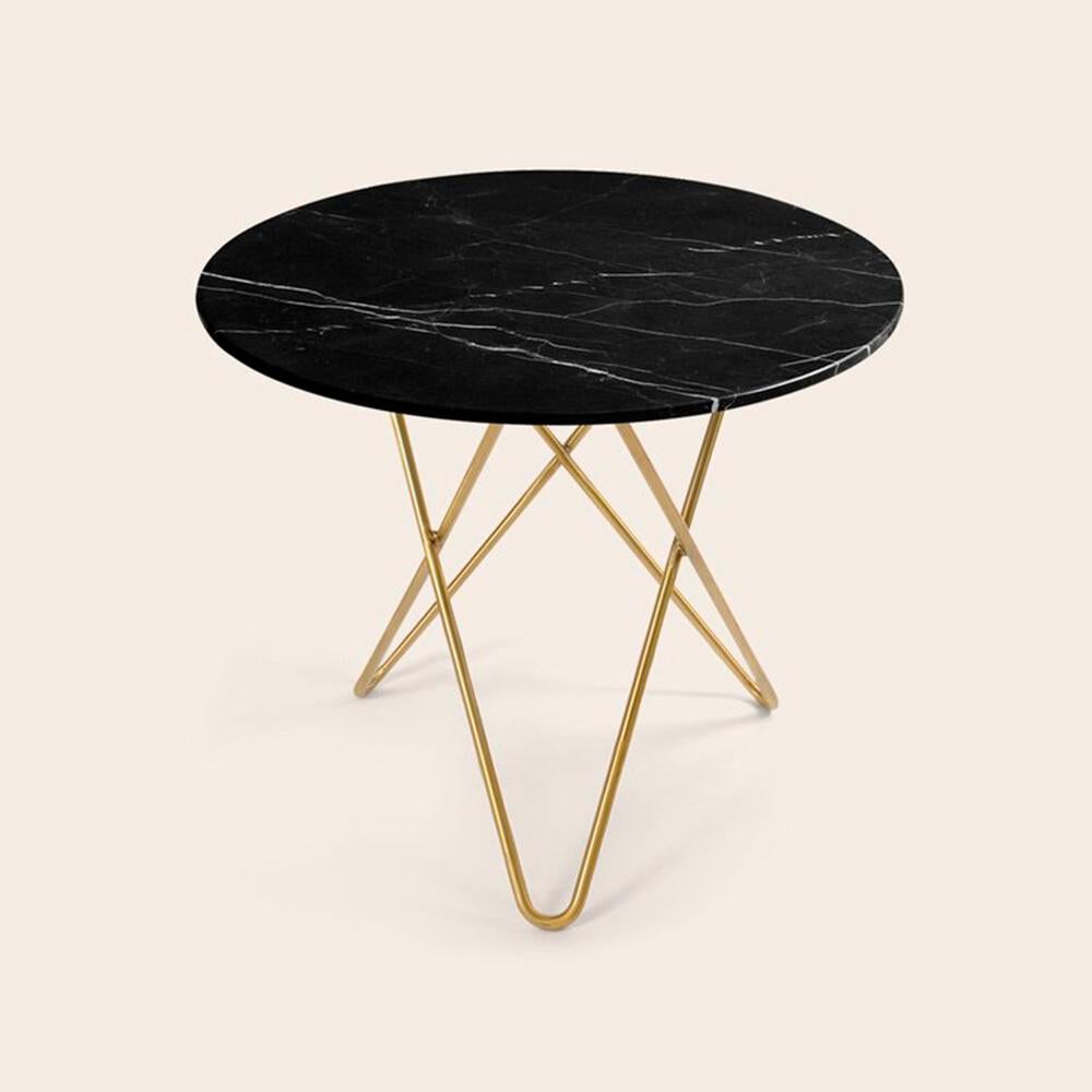Black Marquina marble and brass large dining O table by Ox Denmarq
Dimensions: D 100 x H 72 cm
Materials: Brass, Black Marquina Marble
Also Available: Different marble and frame options available.

OX DENMARQ is a Danish design brand aspiring