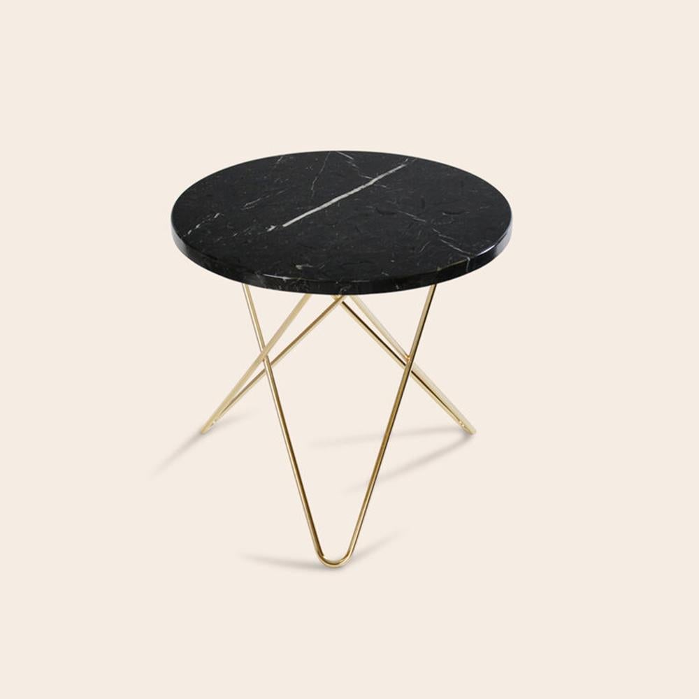 Black Marquina Marble and Brass Mini O Table by OxDenmarq
Dimensions: D 40 x H 37 cm
Materials: Brass, Black Marquina Marble
Also Available: Different top and frame options available,

OX DENMARQ is a Danish design brand aspiring to make