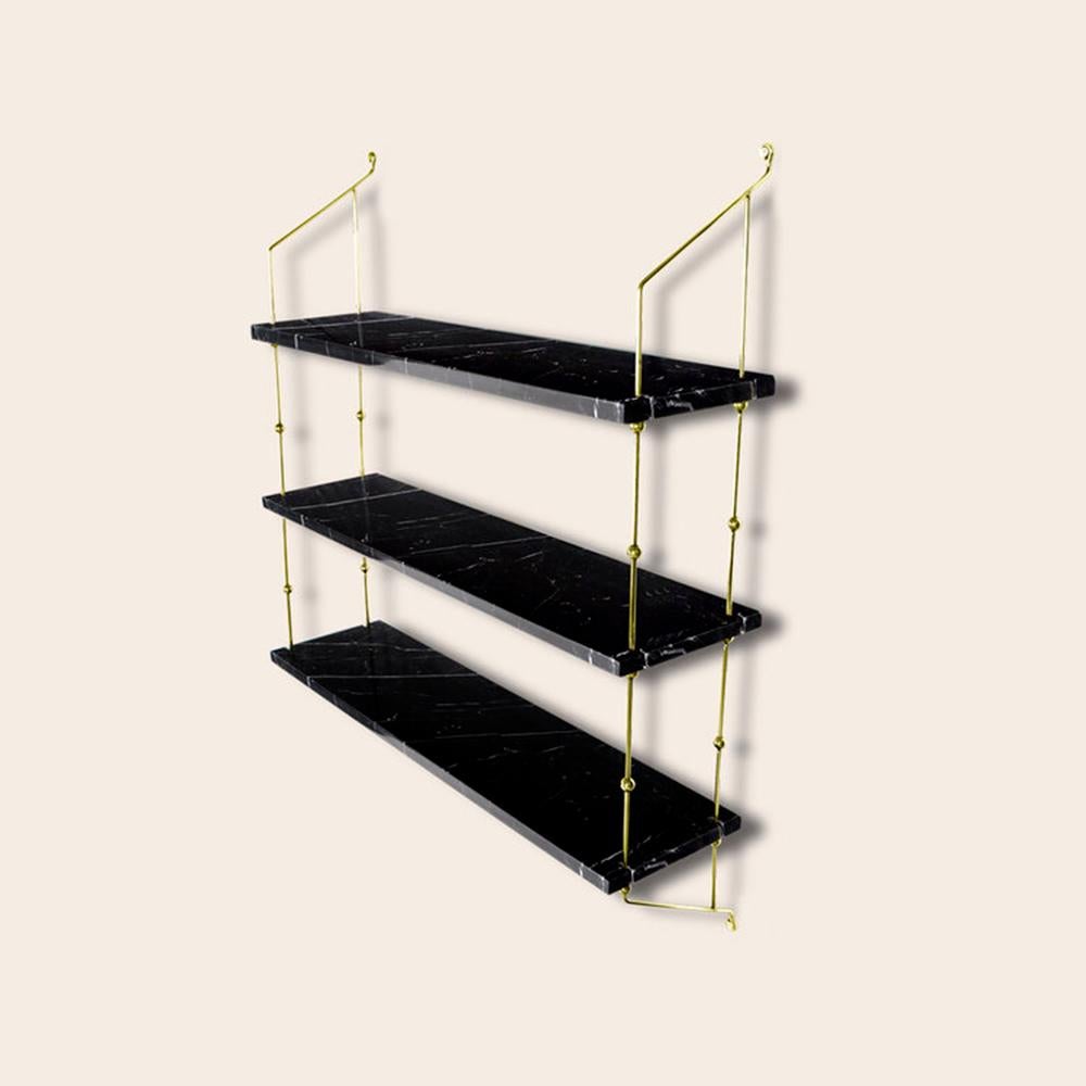 Black Marquina marble and brass Morse shelf by OxDenmarq
Dimensions: D 21 x W 80 x H 87 cm
Materials: Brass, black marquina marble
Also Available: Different marble and frame options available.

OX DENMARQ is a Danish design brand aspiring to