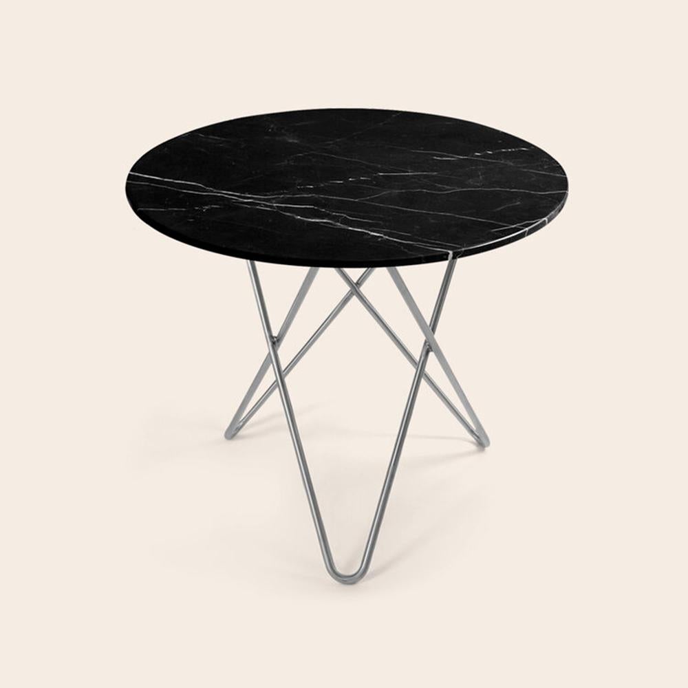 Black Marquina marble and stainless steel large dining o table by OxDenmarq
Dimensions: D 100 x H 72 cm
Materials: Steel, Black Marquina Marble
Also Available: Different marble and frame options available.

OX DENMARQ is a Danish design brand