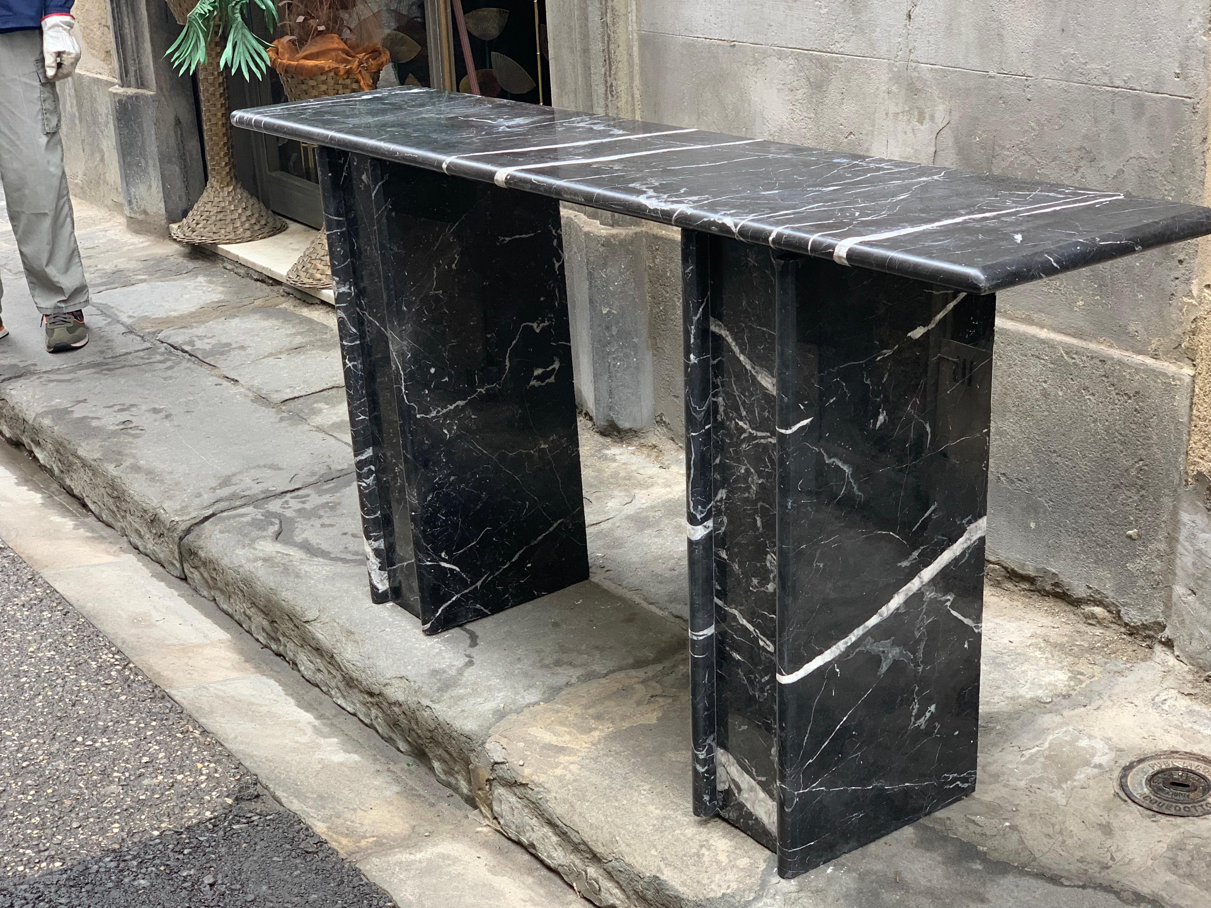 Black Marquina Marble console. The console is made up of three marble pieces, the top that rests on two columns. We have the pair available.
 