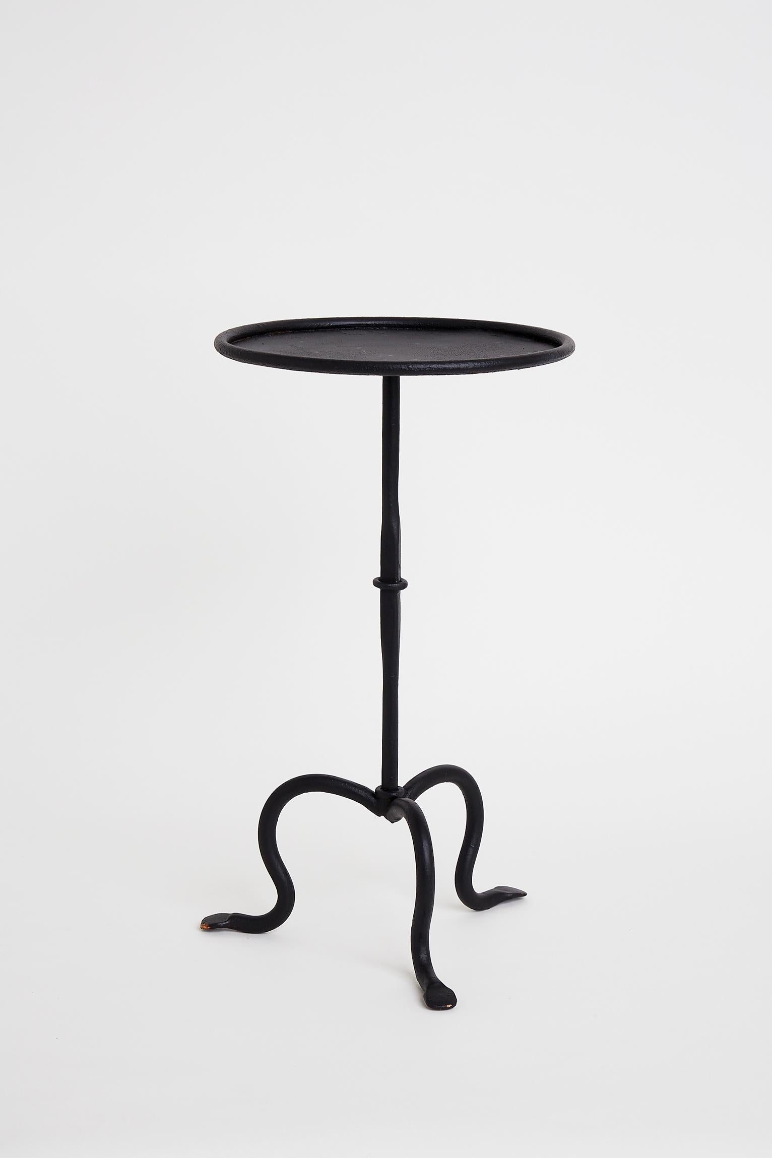 A black enameled wrought iron martini table.
Spain, late 20th century.