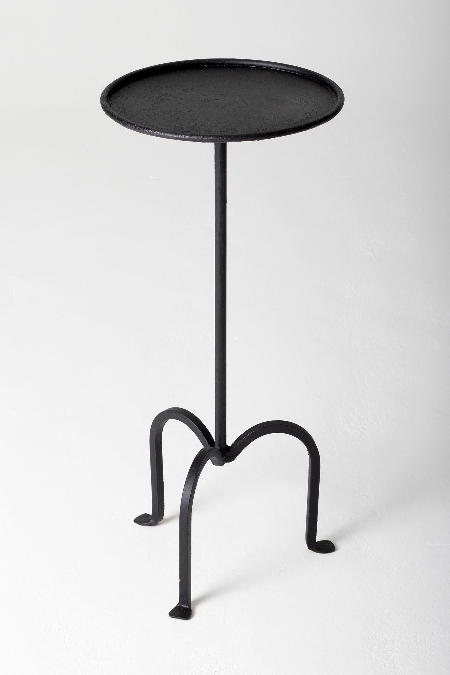 A black patinated wrought iron martini table.
Spain, second half of the 20th century.