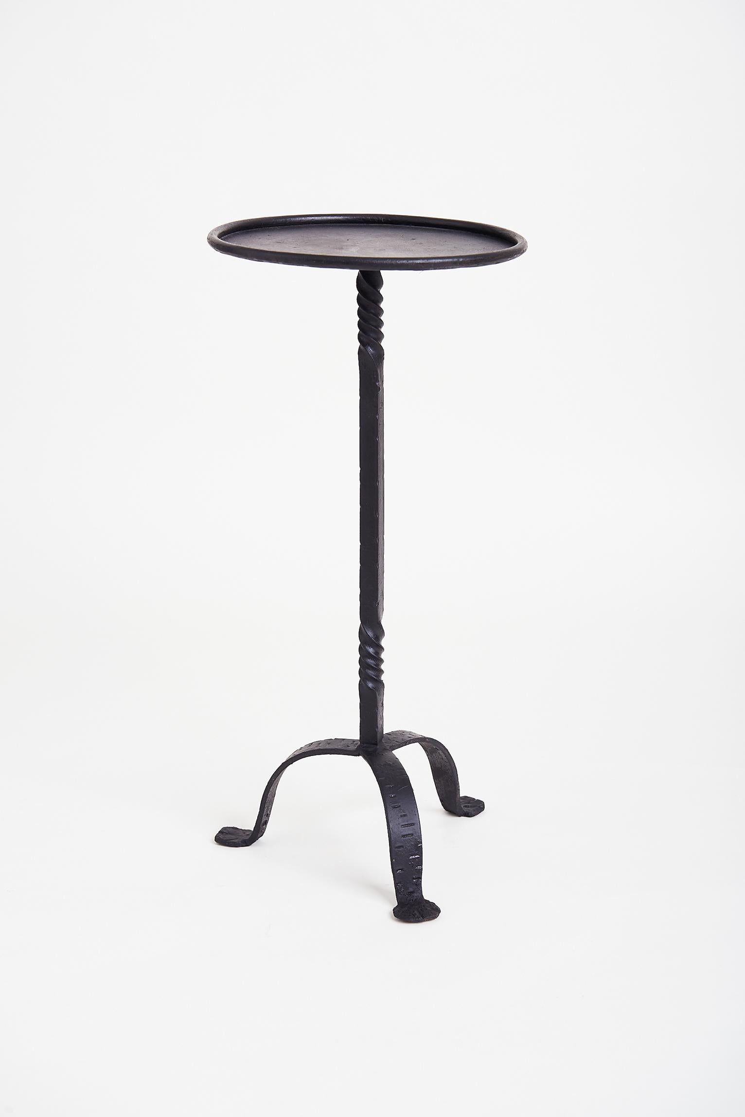 A black enameled wrought iron martini table.
Spain, third quarter of the 20th century.