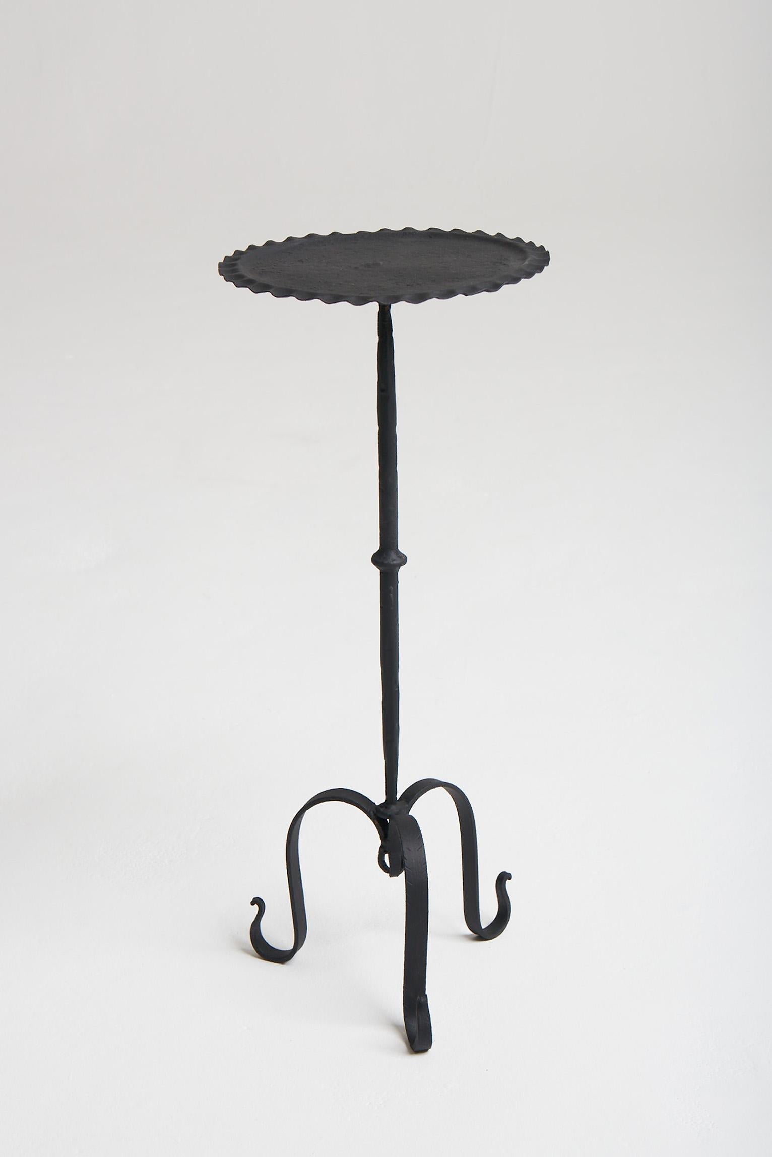 A black enameled wrought iron martini table.
Spain, third quarter of the 20th century.
