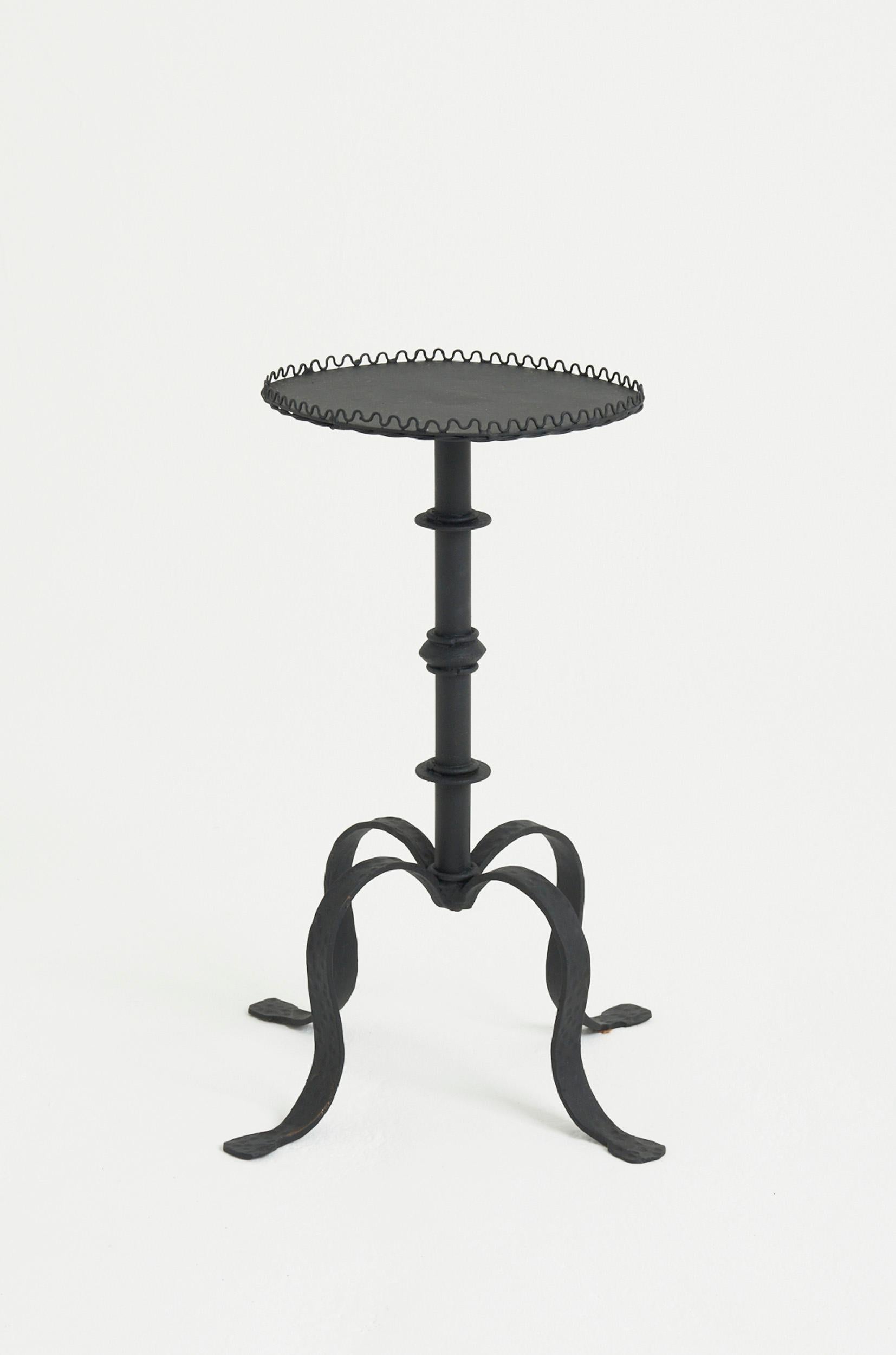 A most unusual oval top black patinated wrought iron martini table.
Spain, mid 20th Century
57.5 cm high by 30 cm wide by 25 cm depth
Martini Base: 35 cm diameter