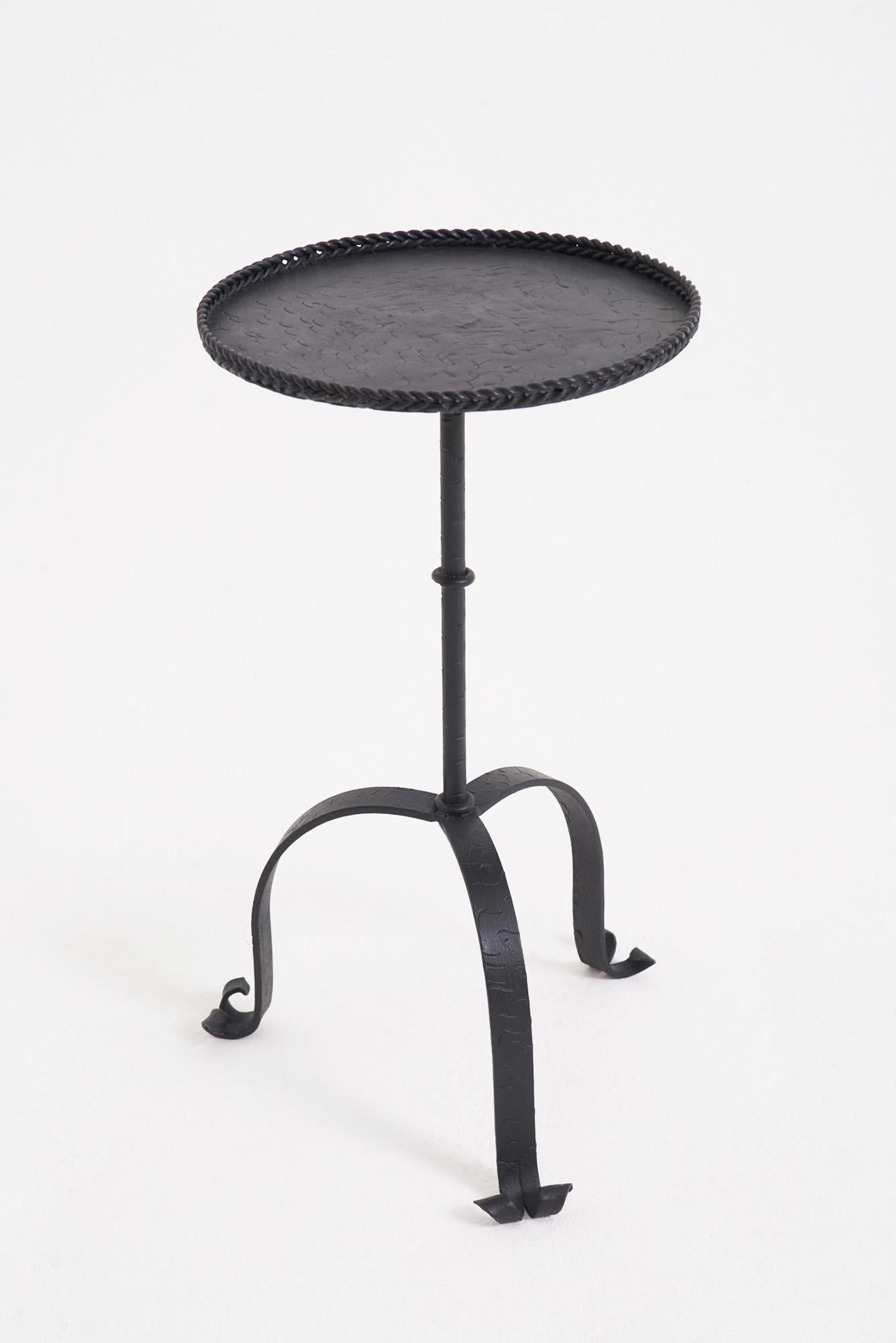 A wrought iron black enamelled martini table
Spain, second half of the 20th Century