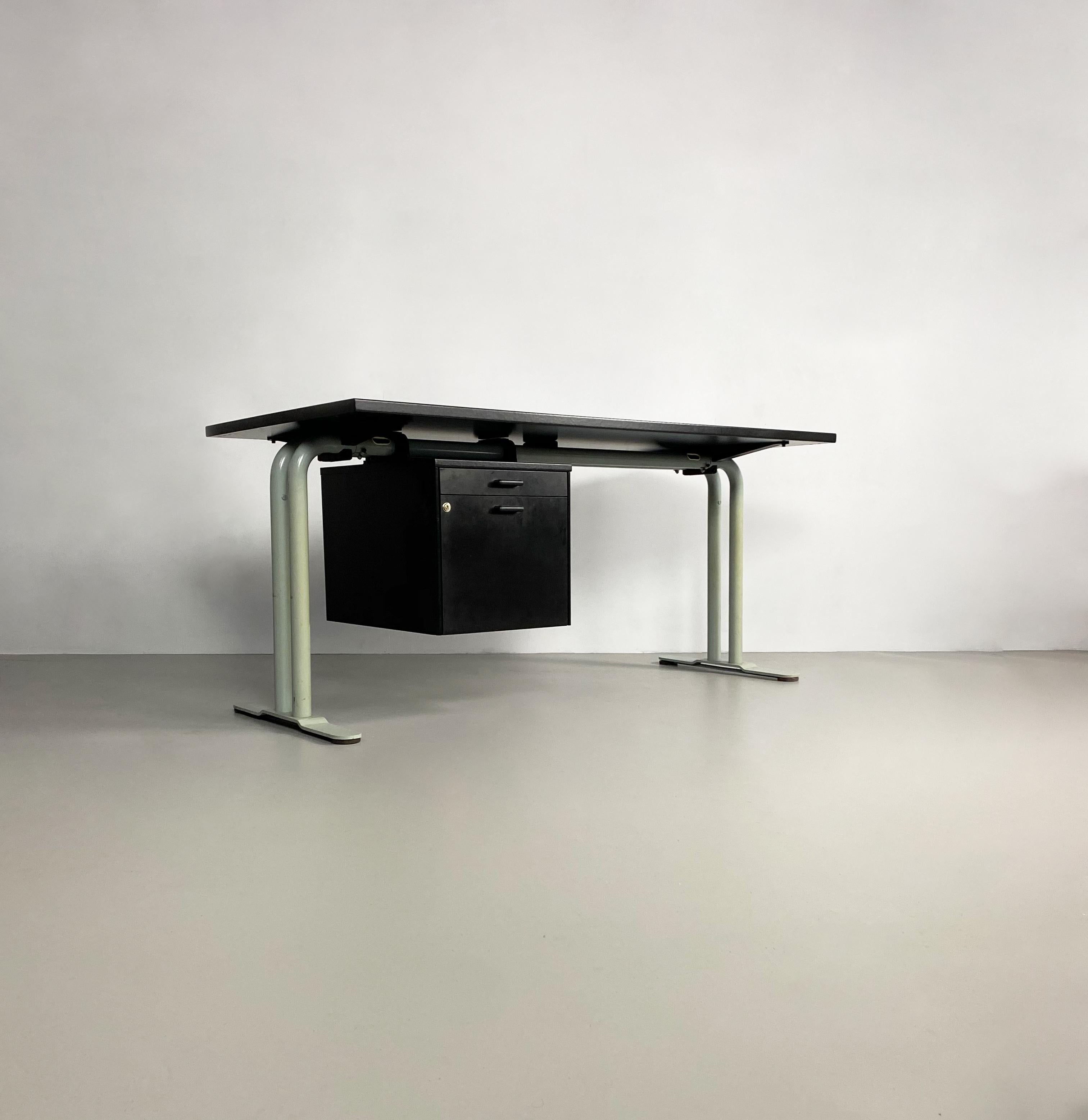 Late 20th century Italian desk by Archiutti featuring thick tubular supporting legs and a suspended bank of drawers.

Dimensions (cm, approx): 
Height: 75 
Width: 160 
Depth: 80

Condition: There are scuffs to the back edges of the desk.
