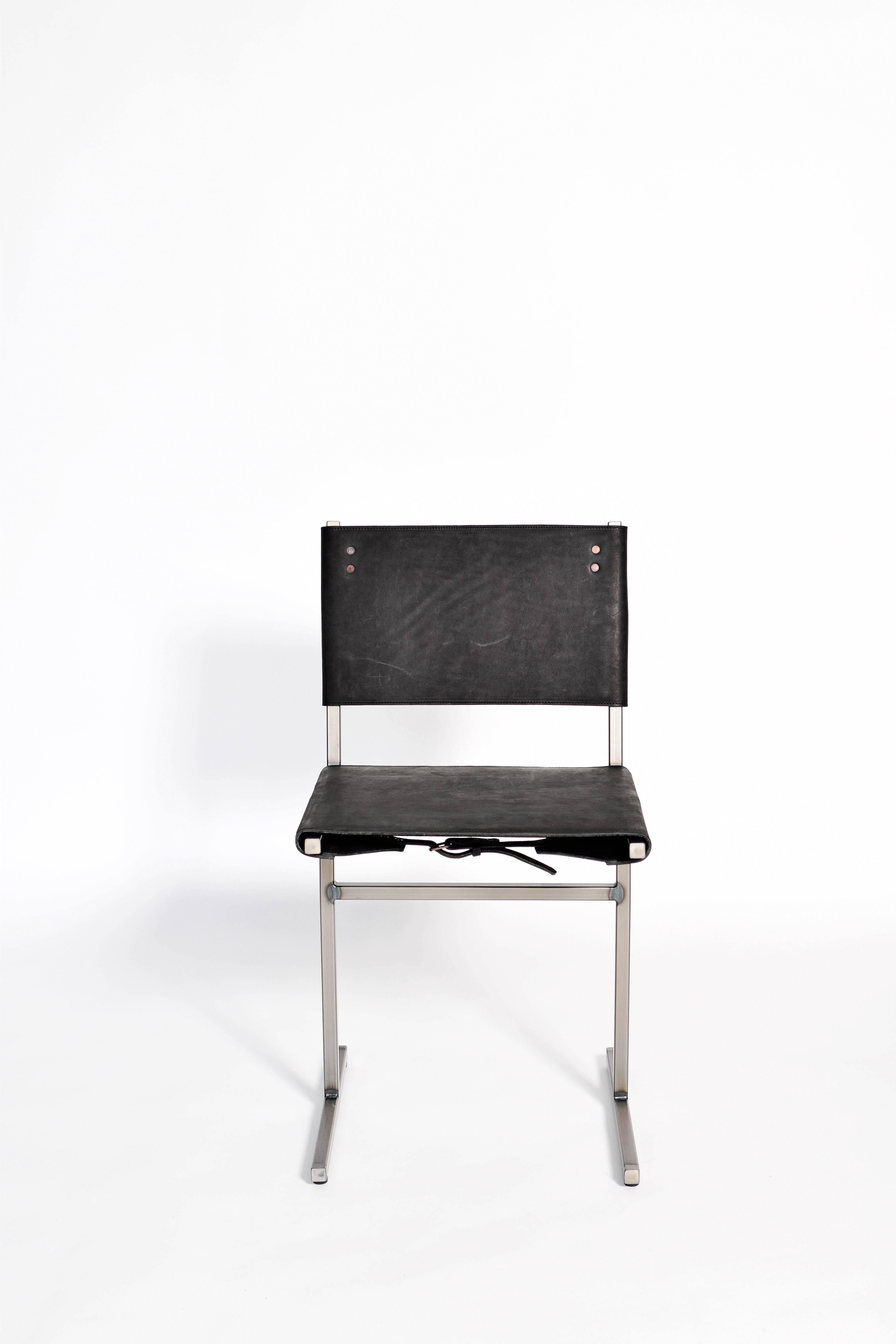 Black Memento chair, Jesse Sanderson
Original signed chair by Jesse Sanderson
Materials: Leather, steel
Dimensions: W 43 x D 50 x H 80 cm 
 Seating height: 47 cm

Frame finishes available in brass, bare steel, matt black.

Five lines and a