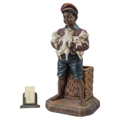 Black Memorabilia, Young Barefoot Boy Holding Baby Pigs, ca.1910, American