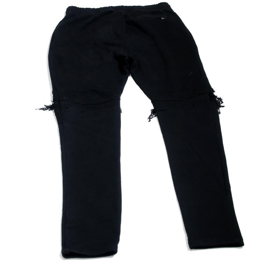 Pantalon de survêtement noir MX1 Moto Distressed Jogger XXL pour hommes

Le jean mx1 signé Amiri est réinterprété pour la nouvelle saison sous la forme de ce pantalon de survêtement en jersey de coton noir. Une coupe ajustée avec des empiècements en