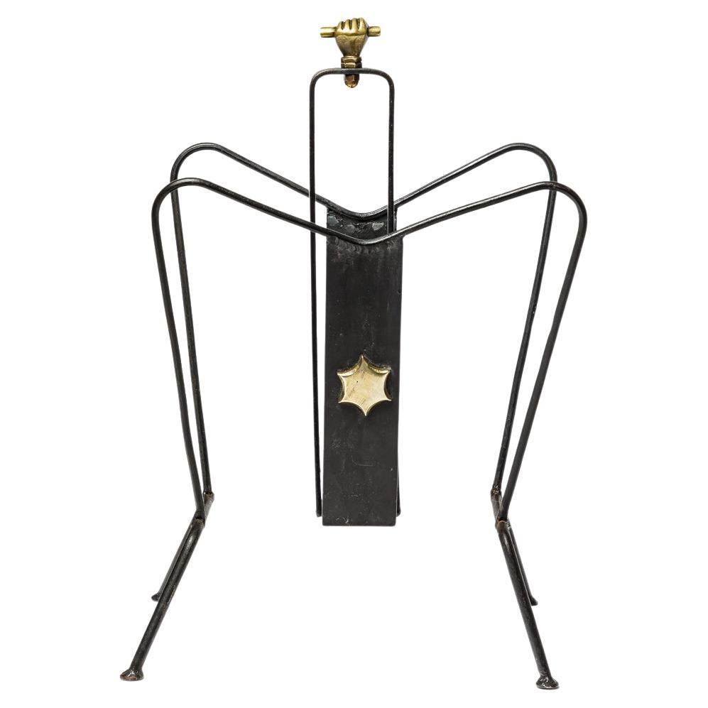 Black metal and shiny gold brass magazine rack att. to Jacques Adnet 1950 design