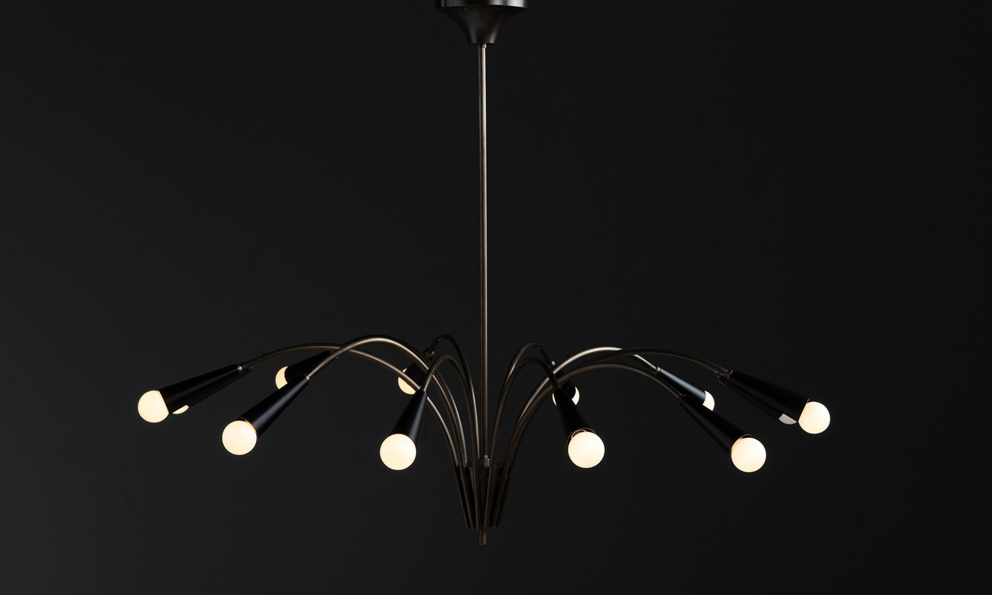 Black metal & brass chandelier

Made in Italy

Modern 12 arm Italian chandelier in brass with black metal shades.

Measures: 44