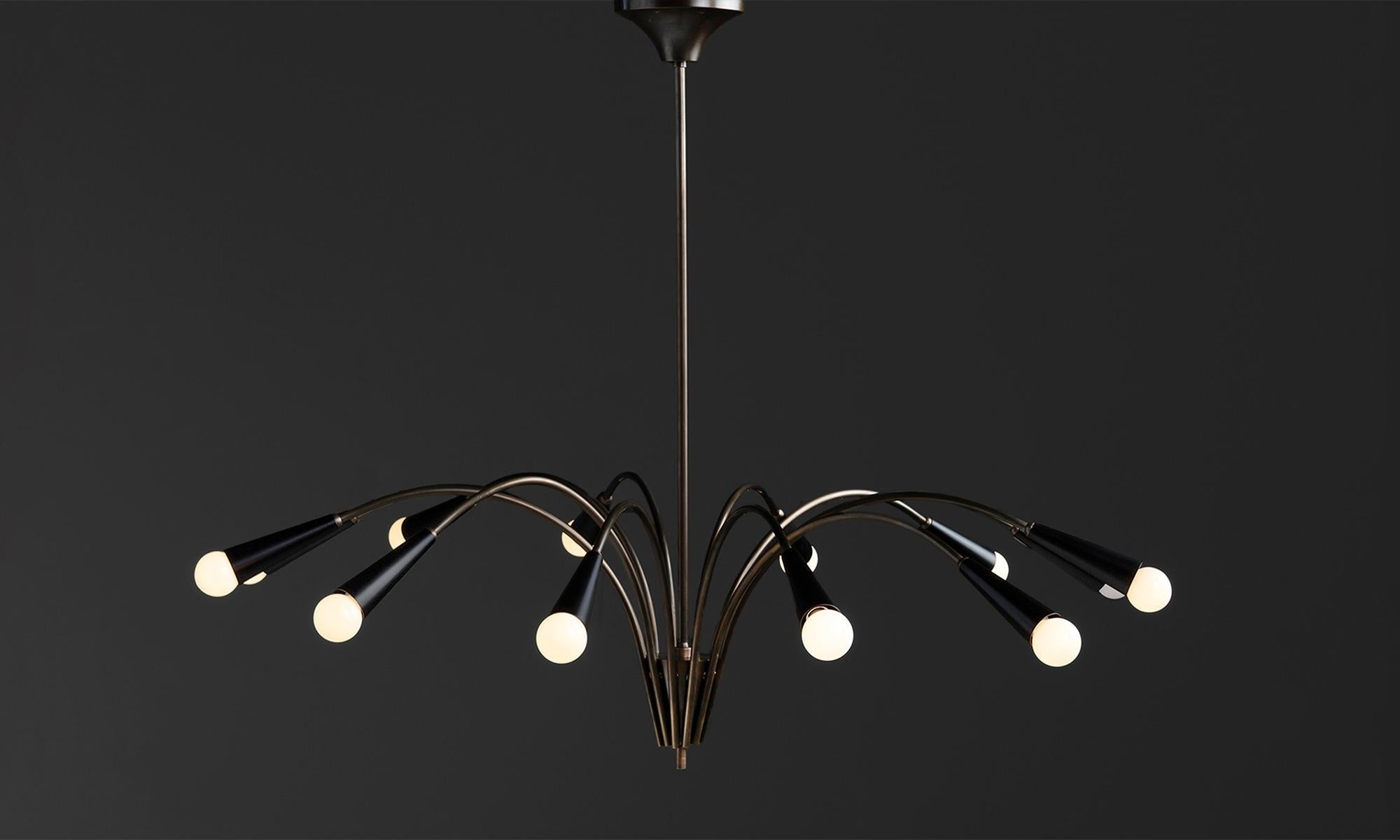Black Metal & Brass Chandelier
Made in Italy
Modern 12 arm Italian chandelier in brass with black metal shades.
44