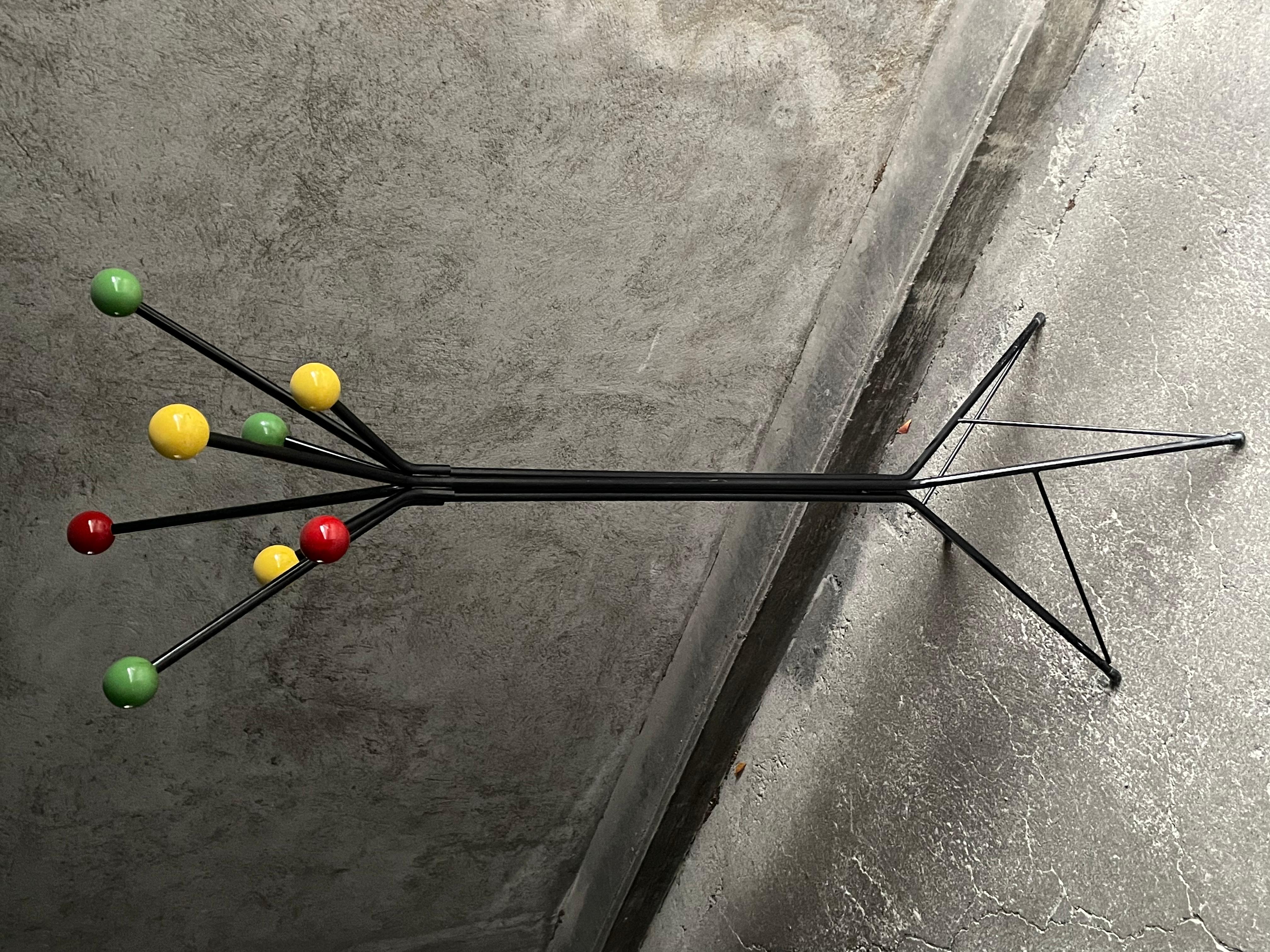 French Black metal coat rack and polychrome balls, 1950s