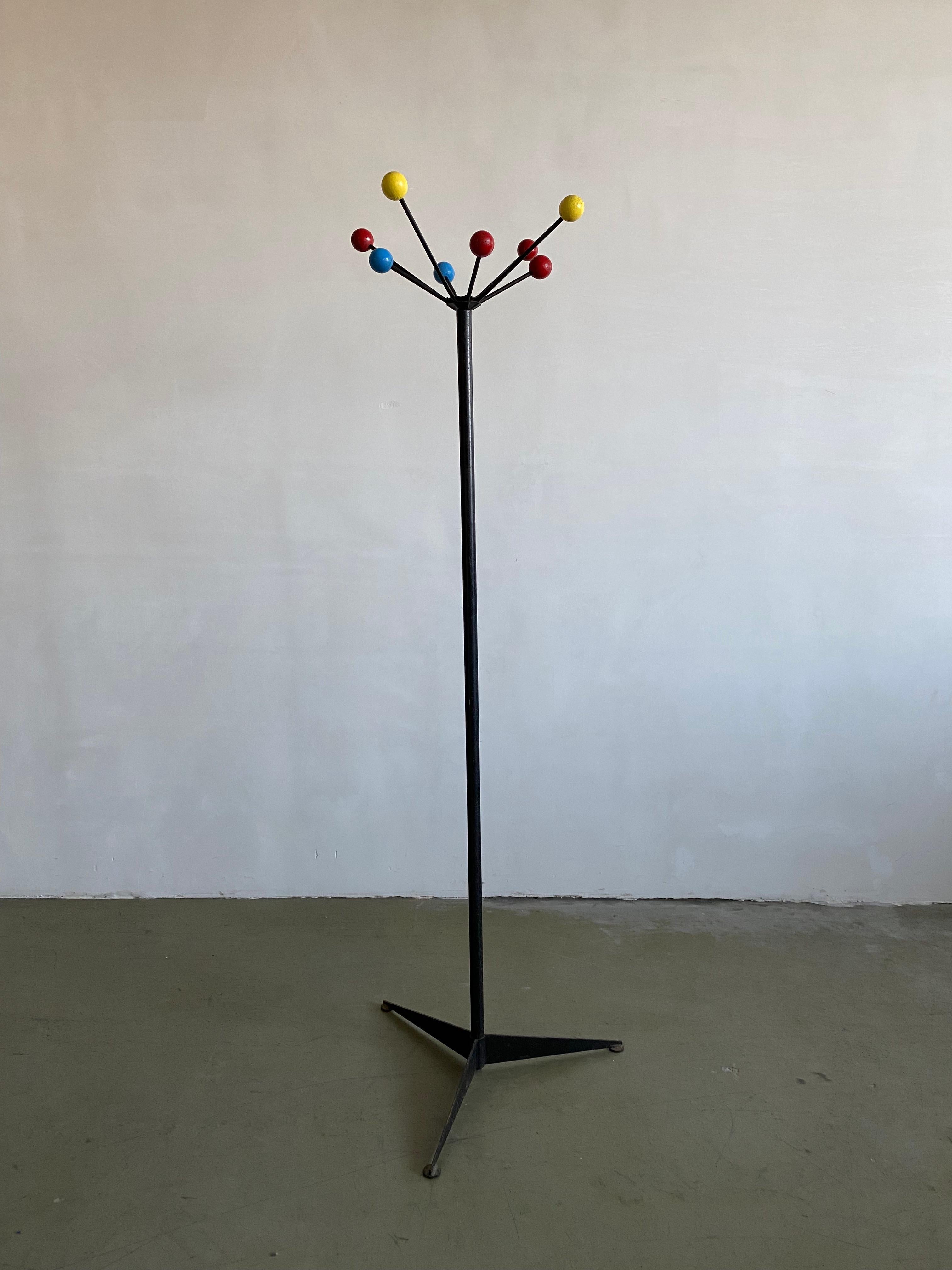 French 1950s coat stand, with 7 coloured wooden balls to hang your coats and bags on. Diameter at the top is 51,5 cm At the bottom diameter is 70 cm.