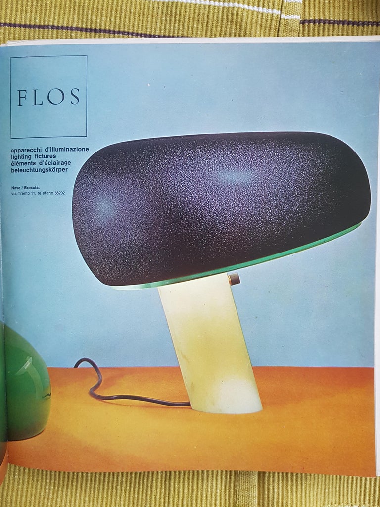 This rare snoopy table lamp belongs to the early 1960s production. It is made from black plastic and marble base with glass and black aluminum shade. The first 1967 version was in fact produced with a black metal lampshade with an elegant 