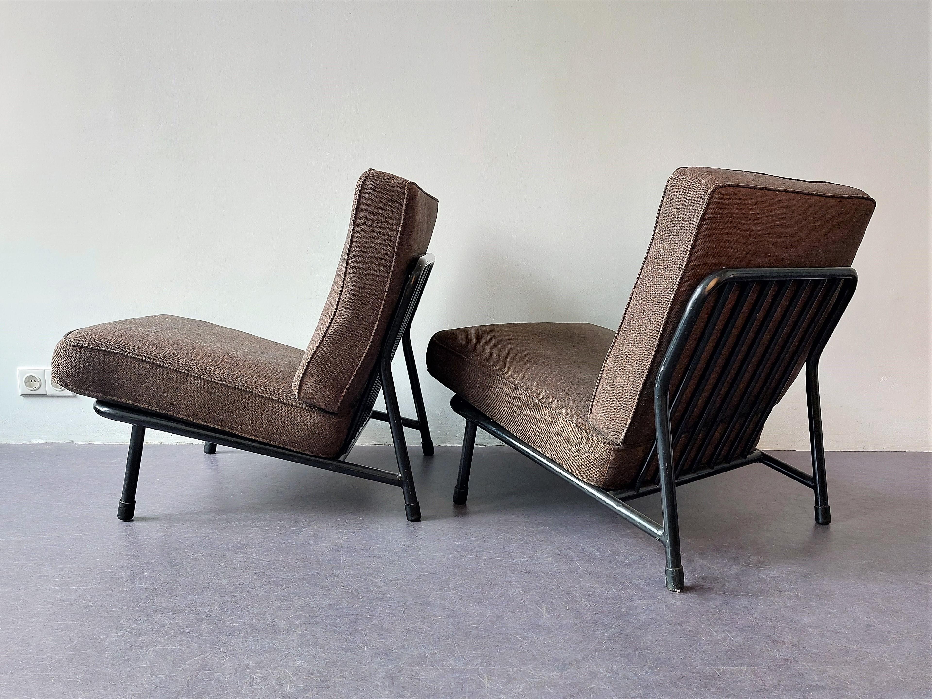 This lounge chair was designed by Alf Svensson for DUX in Sweden in the late 1950's or early 1960's. These metal versions were sold by Artifort in the Netherlands. This is why they are sometimes credited to Artifort. It has an airy black metal frame