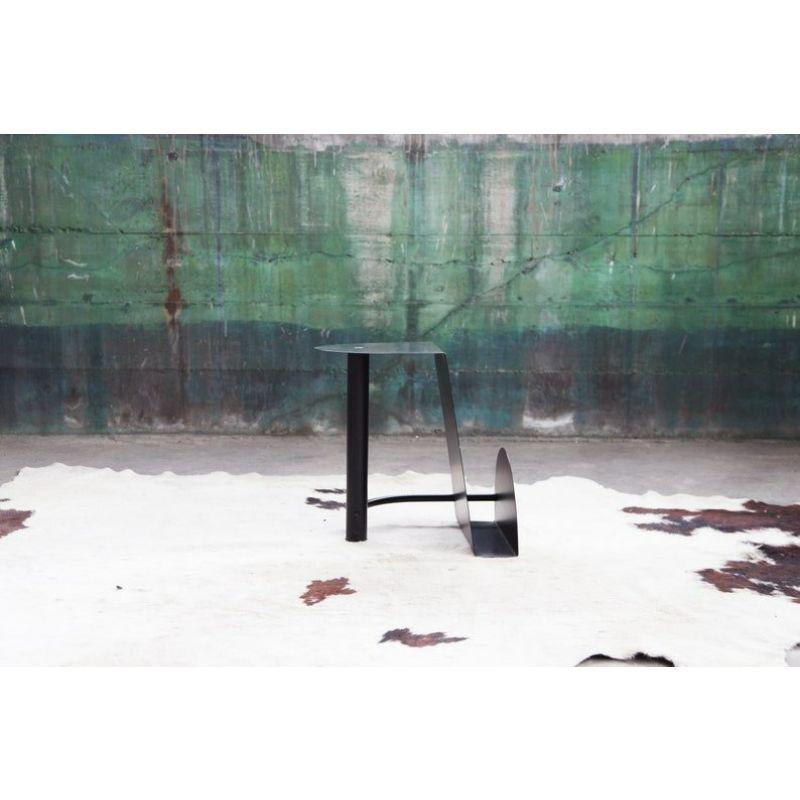 A very excellent accent design piece. This metal, black magazine holder end table would look great in a Modern or Mid-Century decor. It features a gorgeous sculptural design, and does not take up much space but you get a lot of pow in the design.