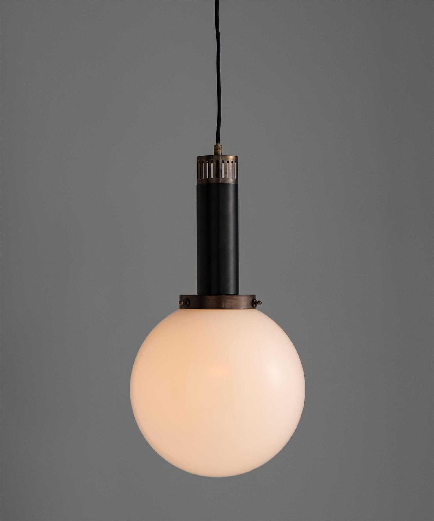 Black Metal & Opaline Globe Pendant
Made in Italy
Brass fittings with black enamel fitter and opaline glass shade.
10.5