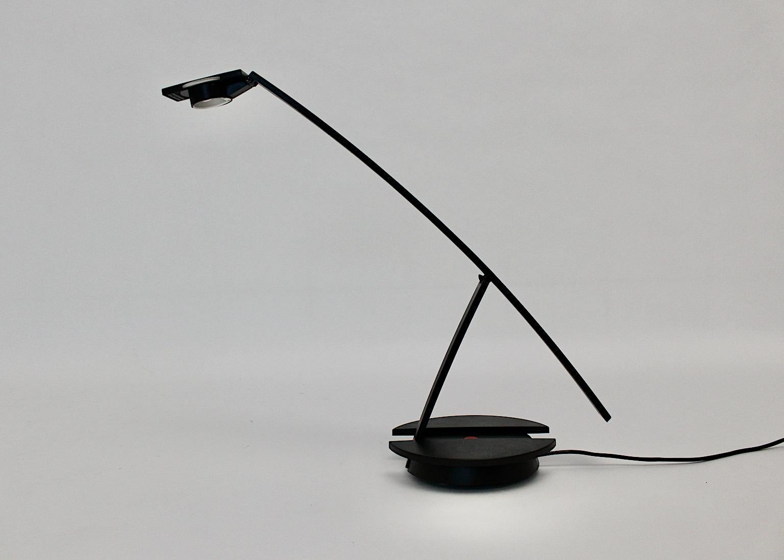 Italian modern table lamp or desk lamp from metal and plastic concorde like in black color by Raul Barbieri for Tronconi Italy, 1980s.
The company's name is labeled underneath the lamp:
Tronconi Master designed by Raul Barbieri Made in Italy 220 V