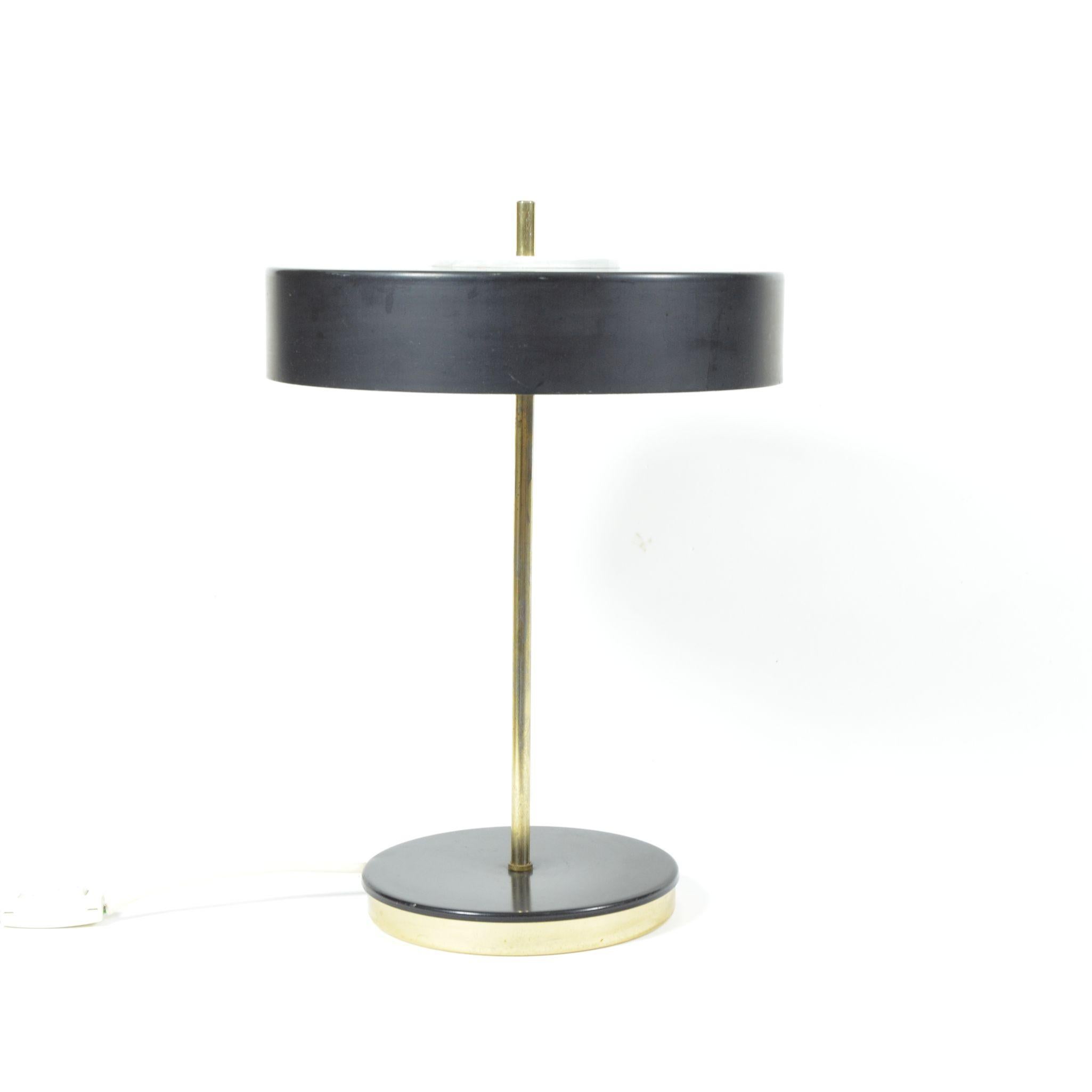 Fully working table lamp in black metal and with brass details. Equipped with two bulbs, screw E27. Original, but very good, condition. Manufactured in former Czechoslovakia by Lustry n. p. Kamenický Šenov.