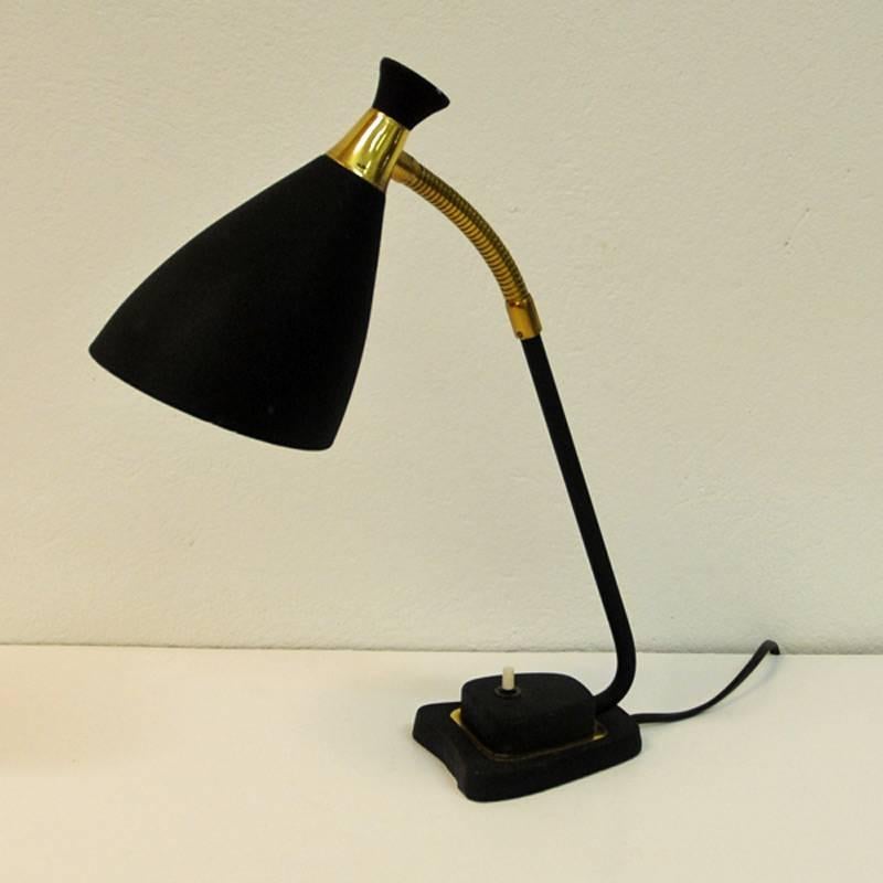 Metal and brass table lamp with adjustable head. Beautiful shaped head with white inner shade. Black matching cord. Nice brushed black color that gives a matt finish look. From Solberg Industrier 1950s, Norway. Measures: 38 cm H (when shade is