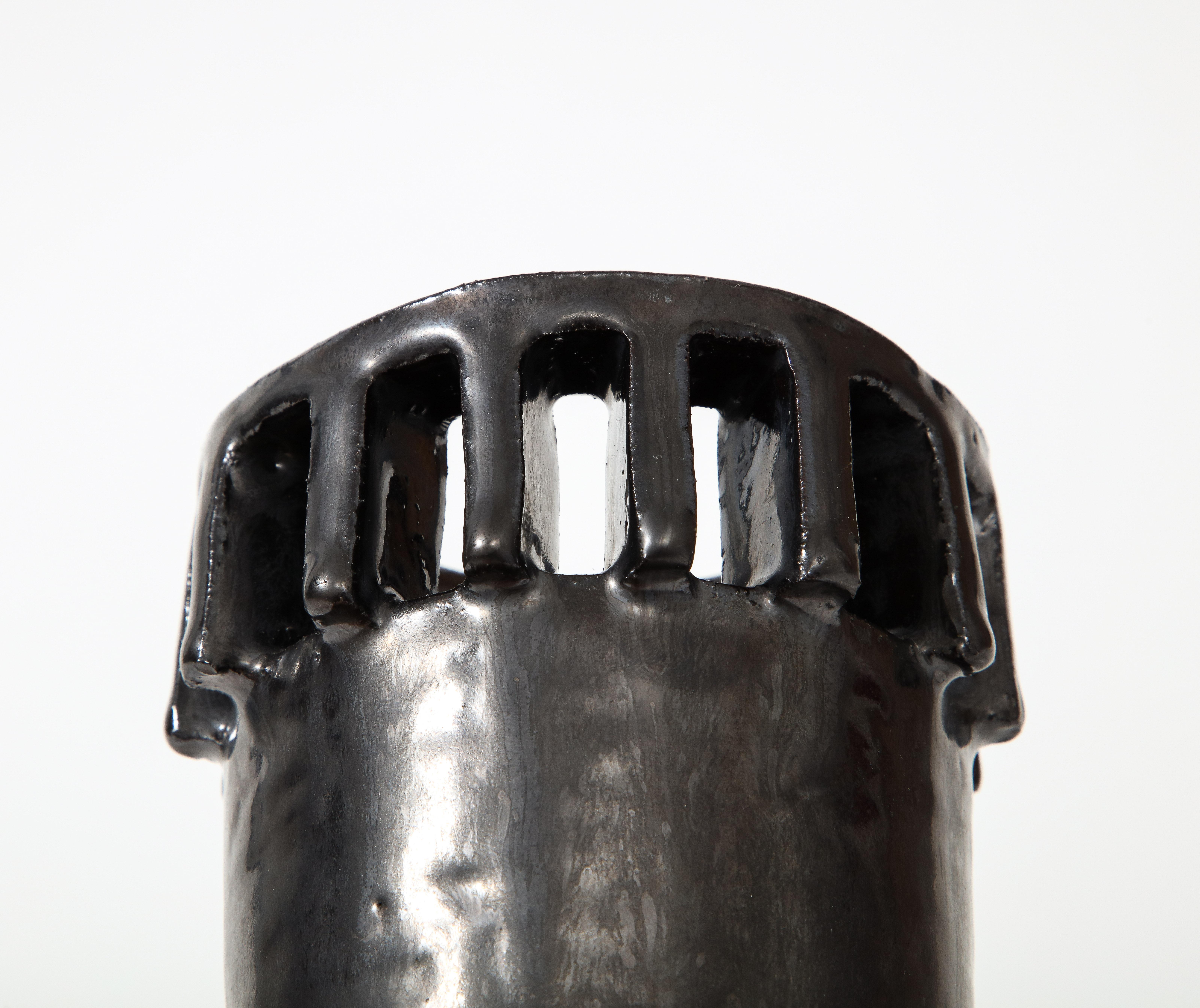 Hand formed and glazed ceramic vase.