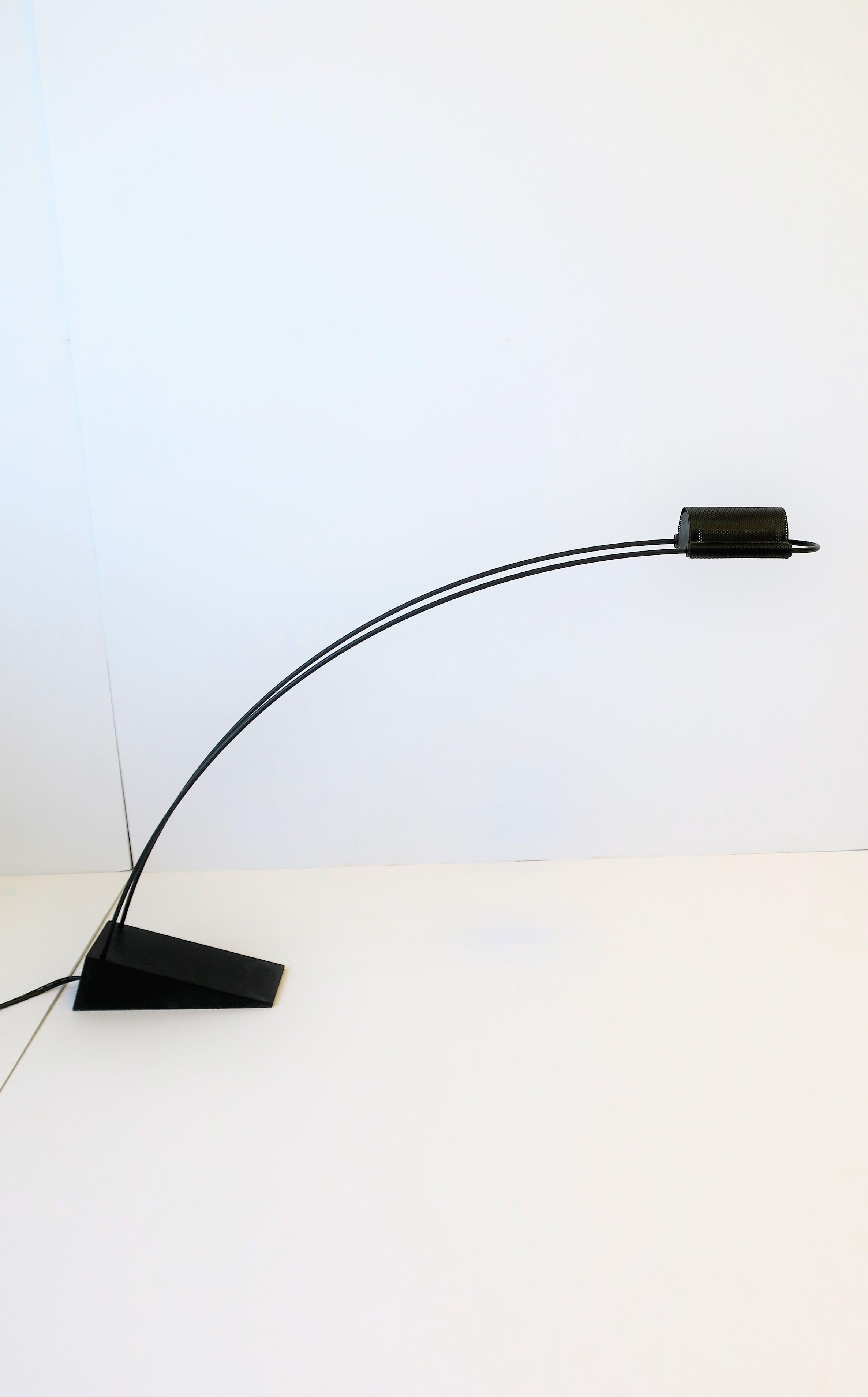 A designer black desk, task, or nightstand table lamp/light, Minimalist design period, 1988. Lamp is by designer Robert Sonneman for Robert Kovacs maker. With designer and makers' mark on bottom as shown in last image. Very good condition as shown
