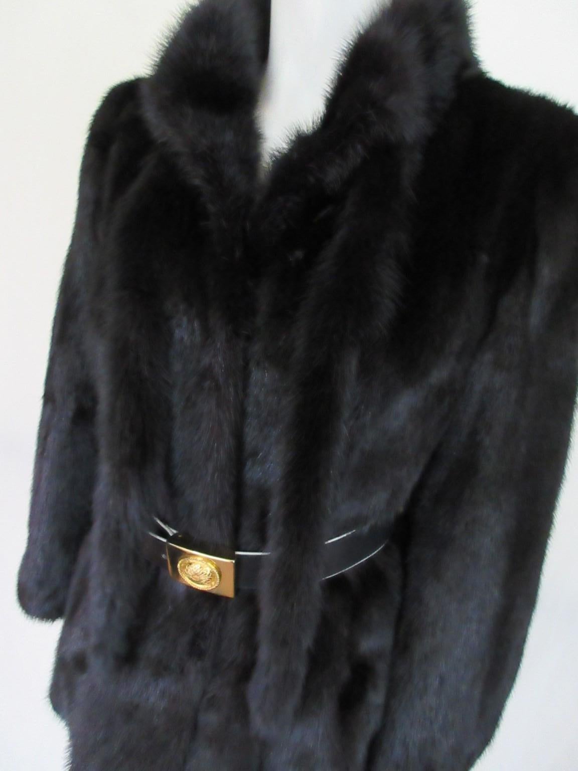 Black vintage mink fur jacket, rare to find.

We offer more black, white, brown mink fur items, view our frontstore.

Details:
With 2 pockets, 3 closing hooks,
2 tassels at front
Fully lined
Belt is not inclusive in this sale
Size fits about medium