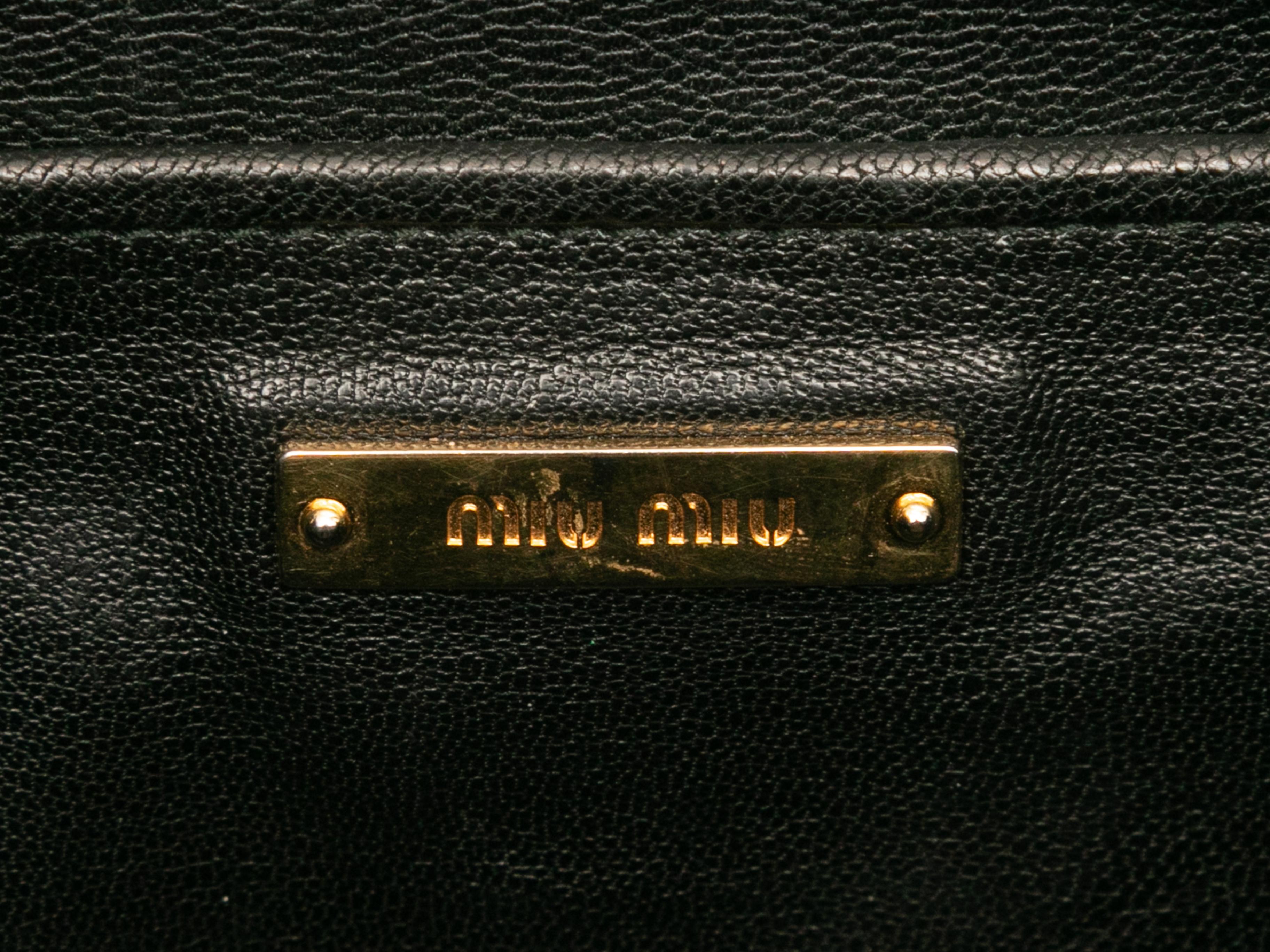 Black Miu Miu Leather Moto Bag. This bag features a leather body, gold-tone hardware, dual front zip closure pockets, an exterior back pocket, dual rolled top handles, an optional shoulder strap, and a top zip closure. 17