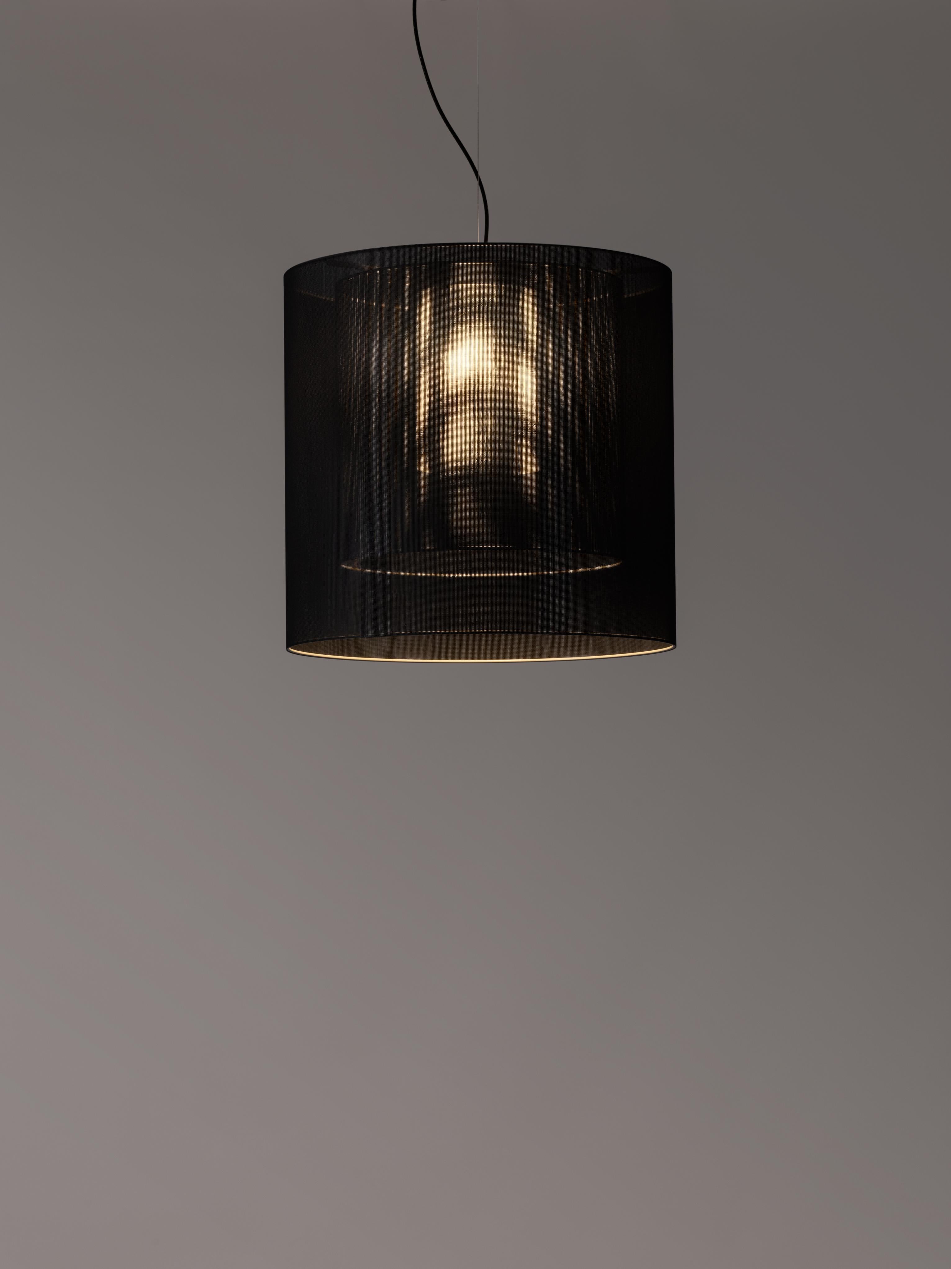 Black Moaré LM pendant lamp by Antoni Arola
Dimensions: D 62 x H 60 cm
Materials: Metal, polyester.
Available in other colors and sizes.

Moaré’s multiple combinations of formats and colours make it highly versatile. The series takes its name