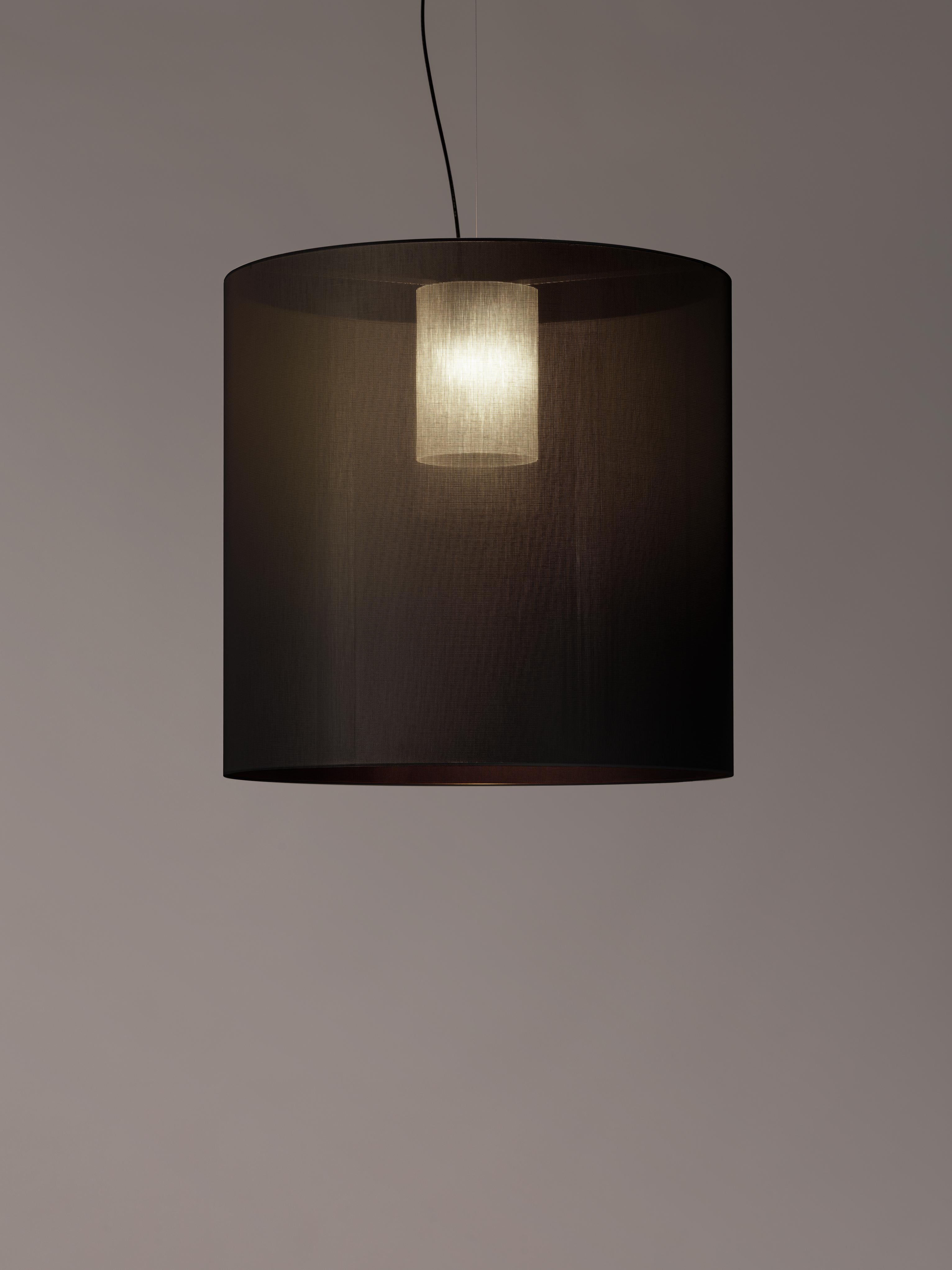 Black Moaré X Pendant Lamp by Antoni Arola.
Dimensions: D 83 x H 81 cm.
Materials: Metal, polyester.
Available in other colors and sizes.

Moaré’s multiple combinations of formats and colours make it highly versatile. The series takes its name