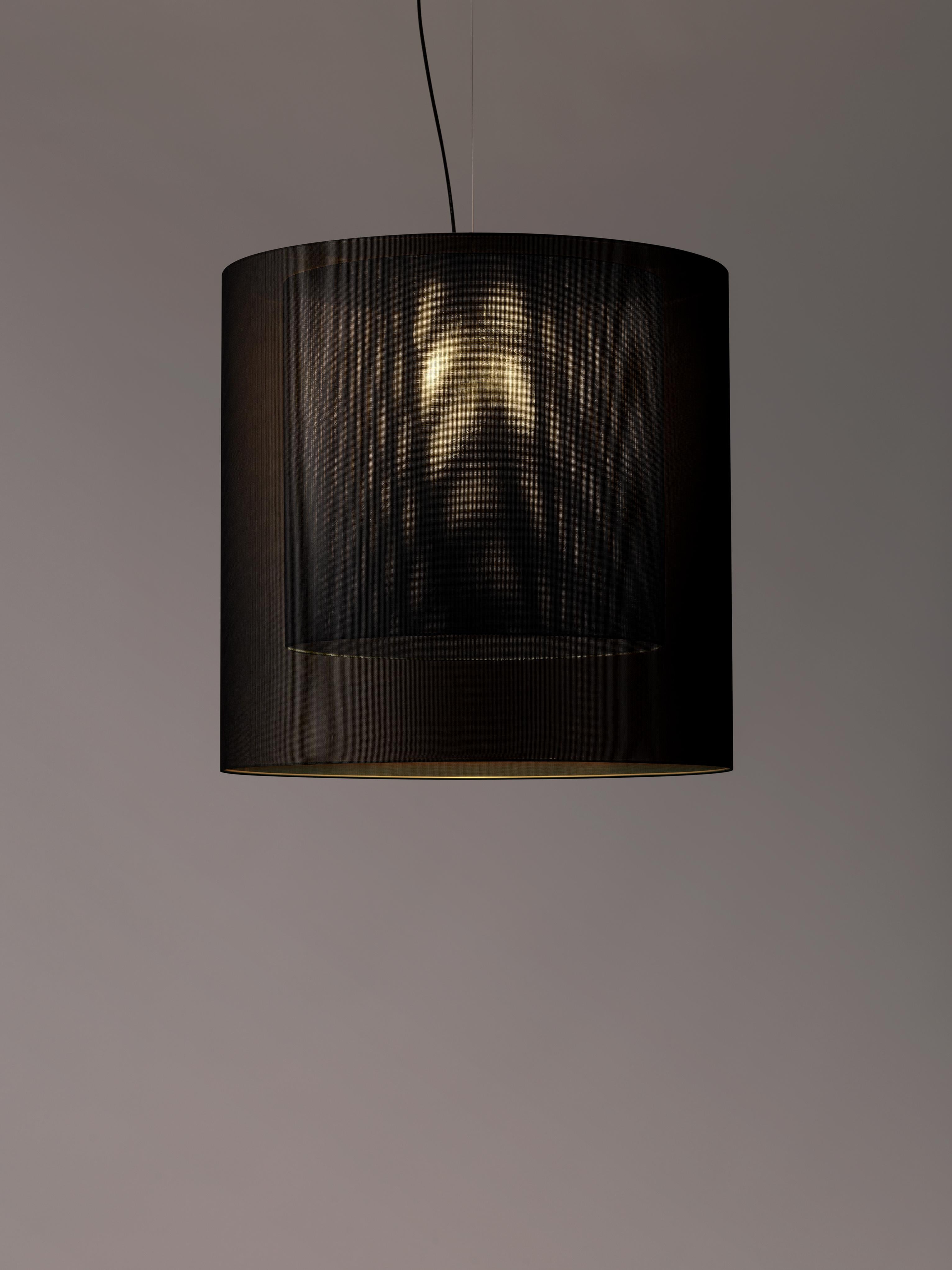 Black Moaré XL pendant lamp by Antoni Arola.
Dimensions: D 83 x H 81 cm.
Materials: Metal, polyester.
Available in other colors and sizes.

Moaré’s multiple combinations of formats and colours make it highly versatile. The series takes its name