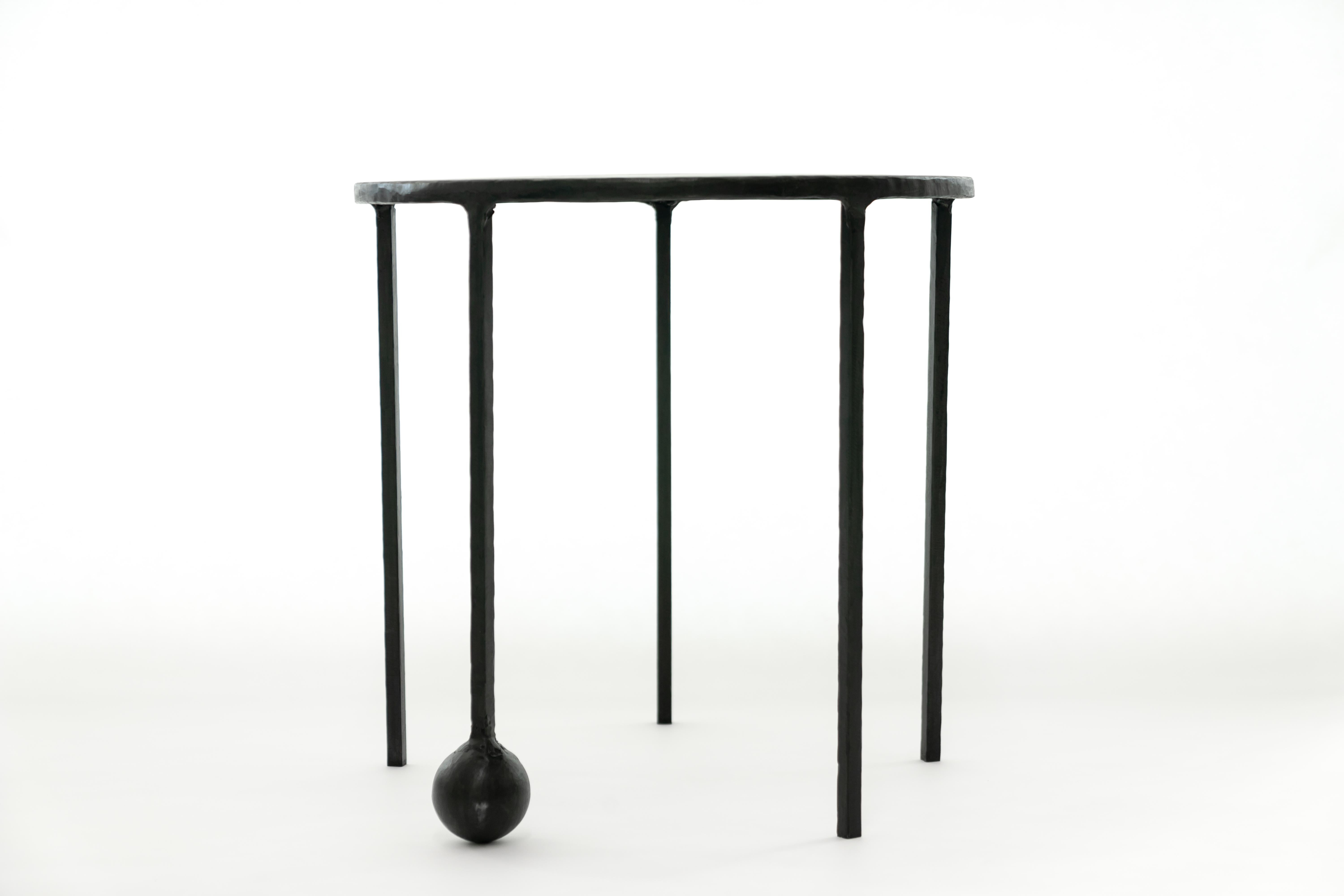 TABLE NO. 2 - Round 
J.M. Szymanski
d. 2018

This geometric, solid, steel structure is supported by a cast-sphere base. The refined simplicity of this design speaks volumes, and adds depth and elegance to any space. 

Custom sizes available. Made in