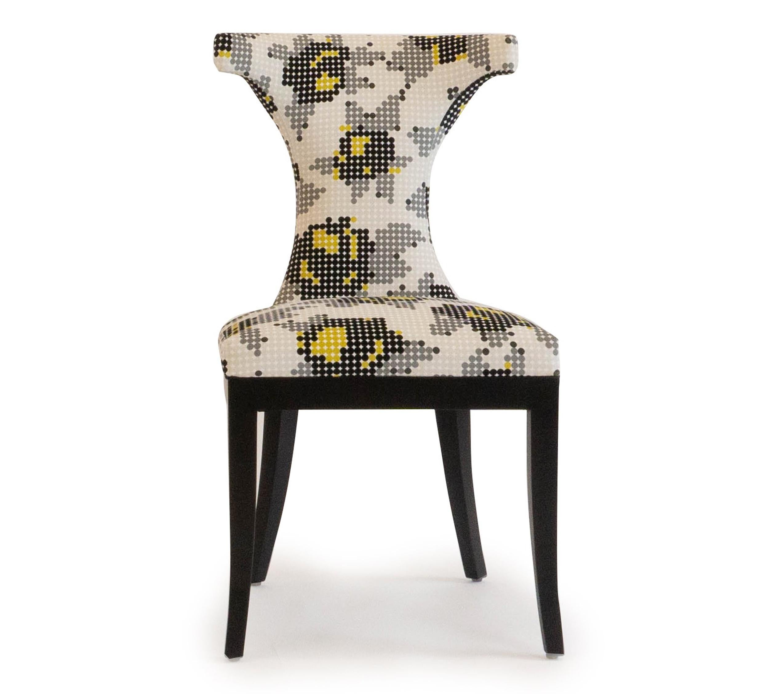 This dining chair has a timeless profile and features added lumbar padding for comfort. Shown in Romo Peg Art Roses with a maple frame in black painted finish. This chair is completely customizable and can be remade as shown or with the customers’