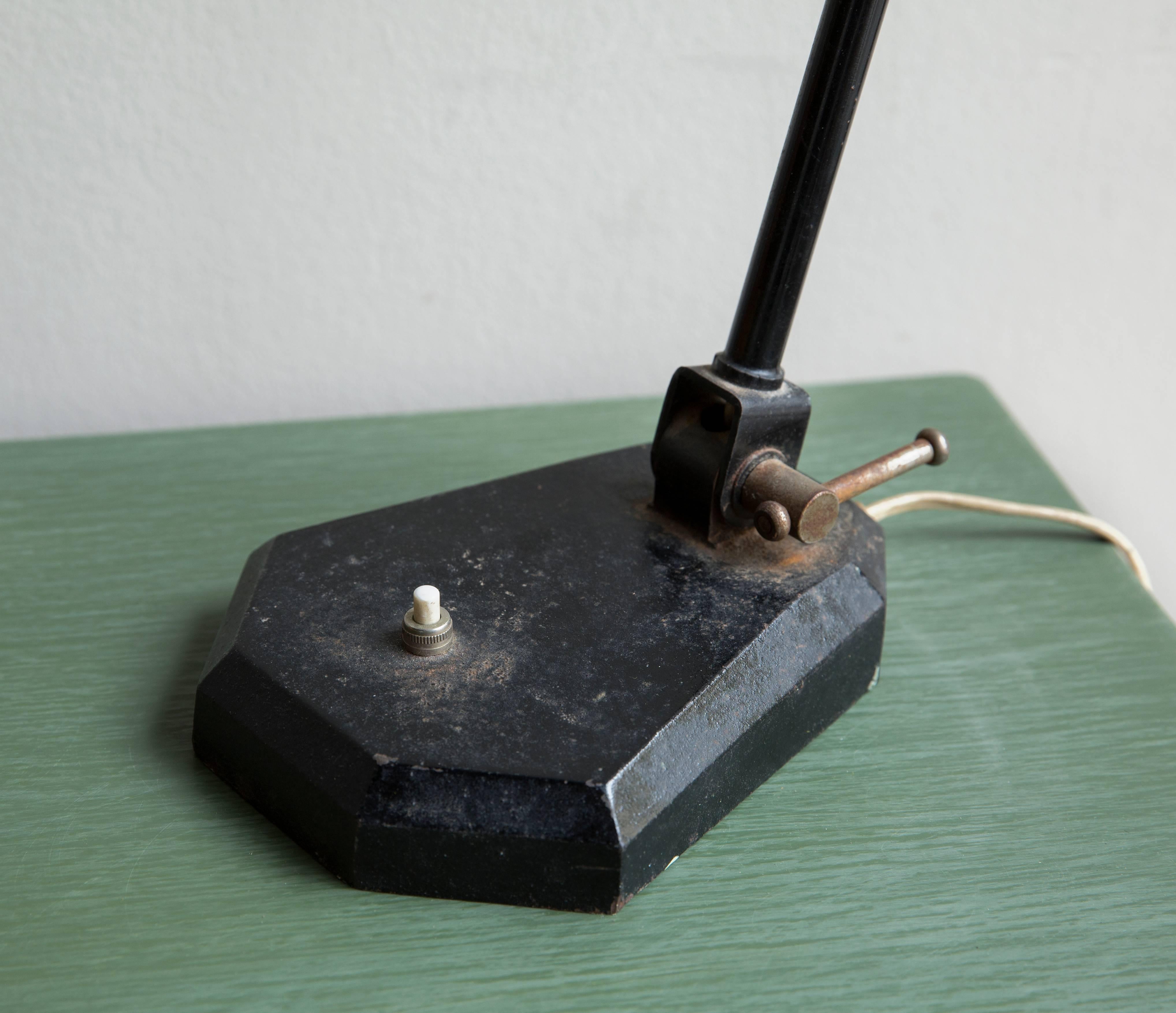 A good modernist adjustable desk lamp in well preserved condition retaining the original black enamelled finish, late 1920s-early 1930s.