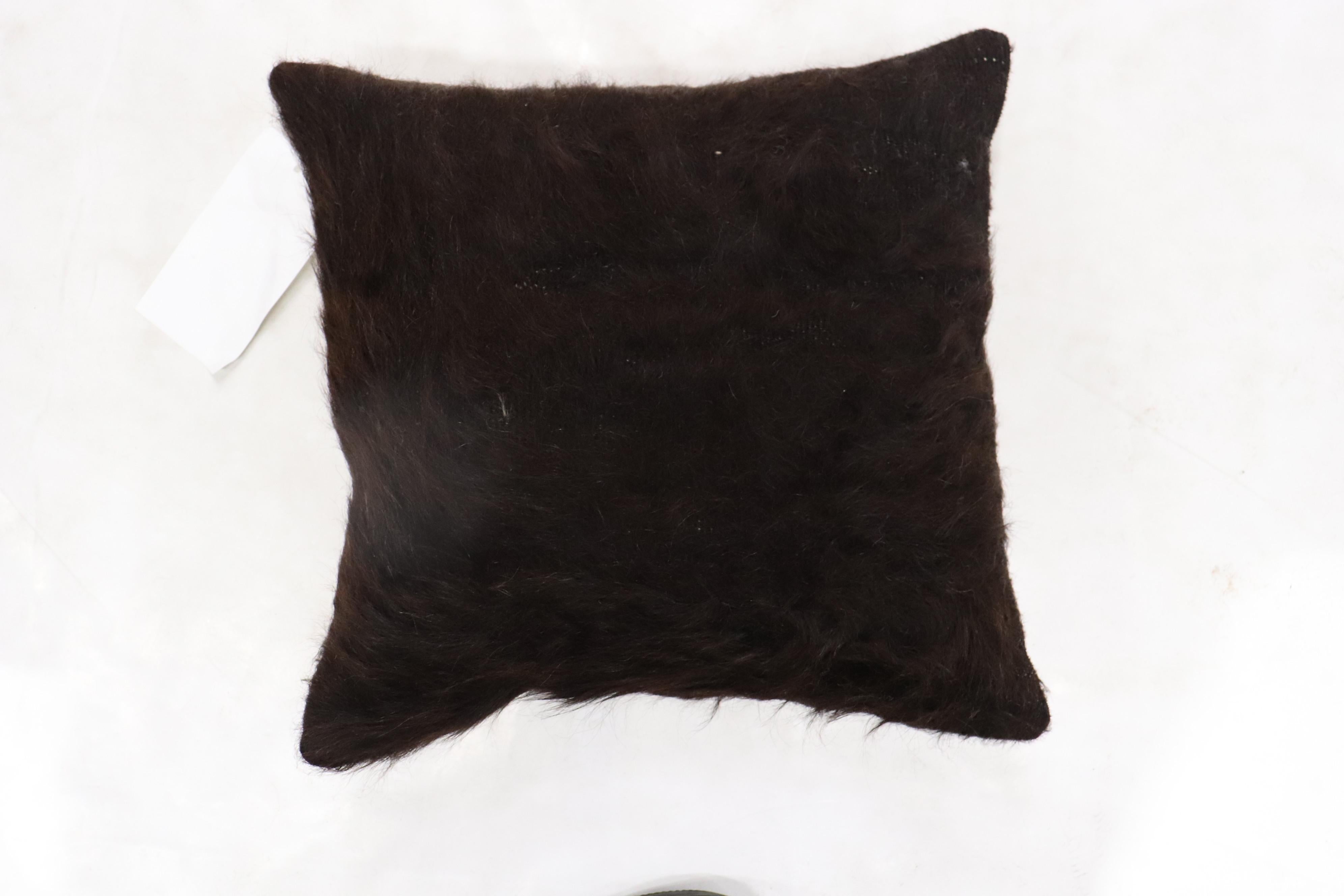 Pillow made from a vintage mohair rug in black. zipper closure and poly foam insert provided.
Measures: 16'' x 16''.