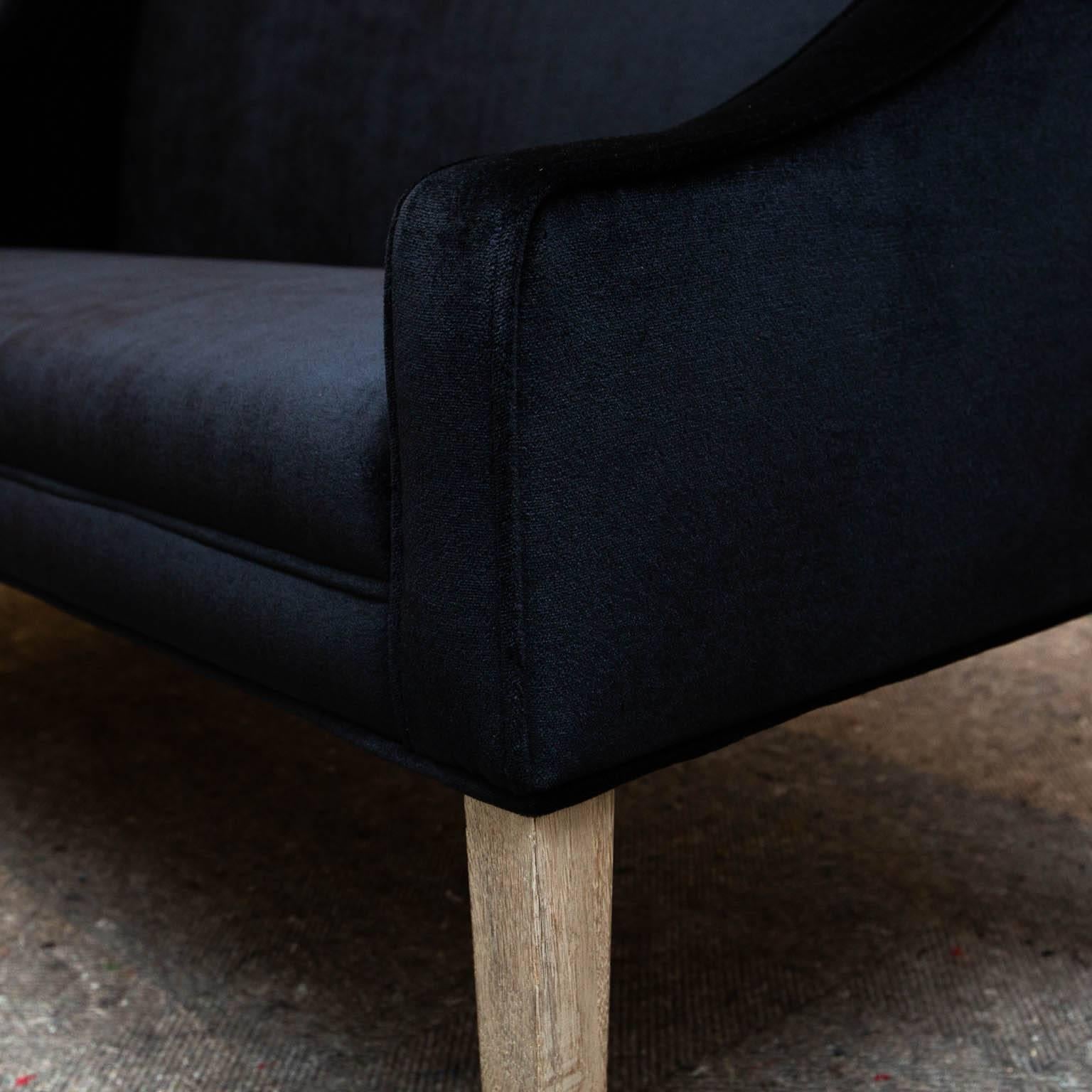 Perfect apartment size settee just reupholstered in black mohair.