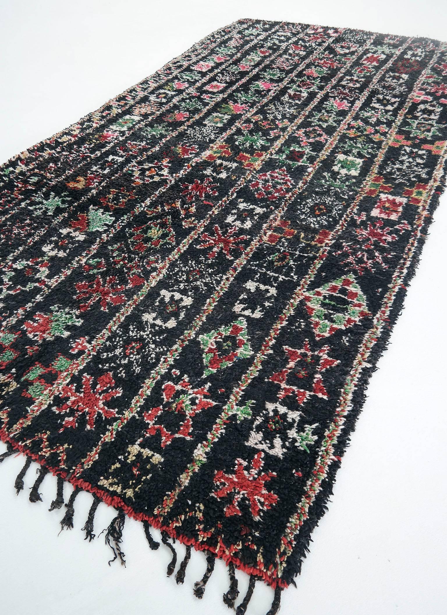 Vintage Moroccan rug

A beautiful Beni MGuild rug in beautiful mysterious colors. The colors are natural dye, the original coloration. Shades of black, green, ruby red, warm orange and pink. 

The Beni M'Guild rugs are thick, deep pile rugs, made